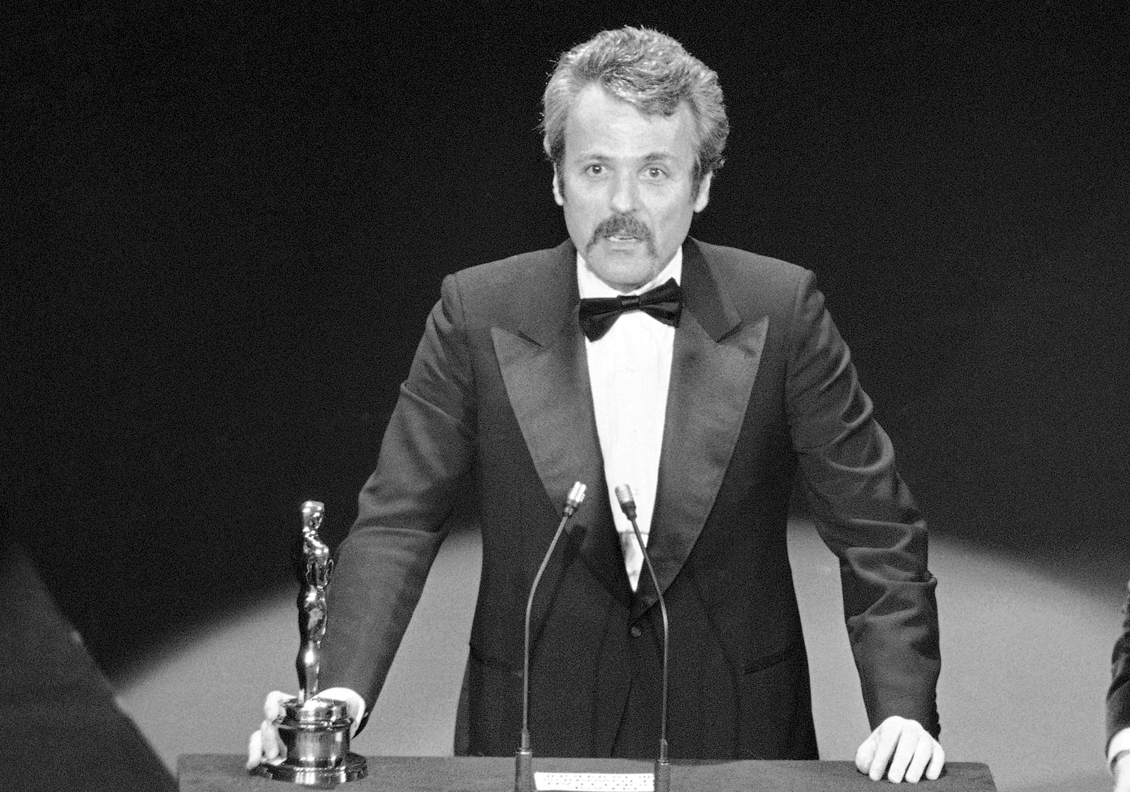 In this March 28, 1977 file photo, William Goldman accepts his Oscar at Academy Awards in Los Angeles, for screenplay from other medium for "All The President's Men." Goldman, the Oscar-winning screenplay writer of “Butch Cassidy and the Sundance Kid” and “All the President’s Men” died, Friday, Nov. 16, 2018. He was 87. (AP Photo, File)