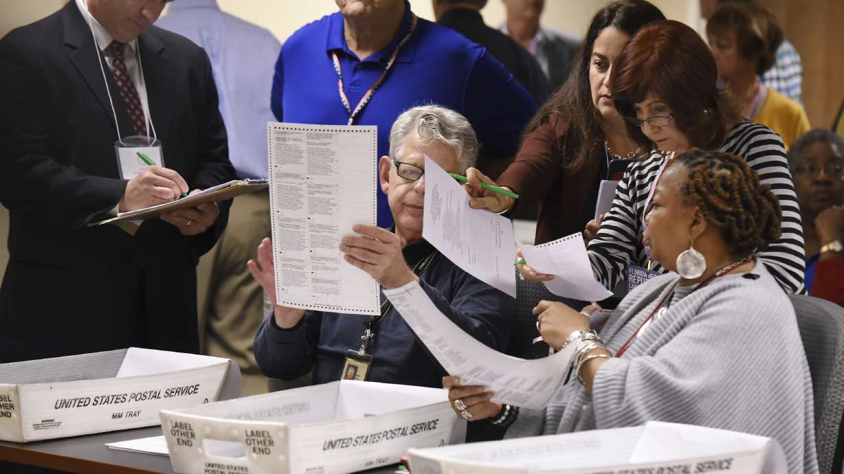 AP Explains: Workers try to decipher intent in hand recount