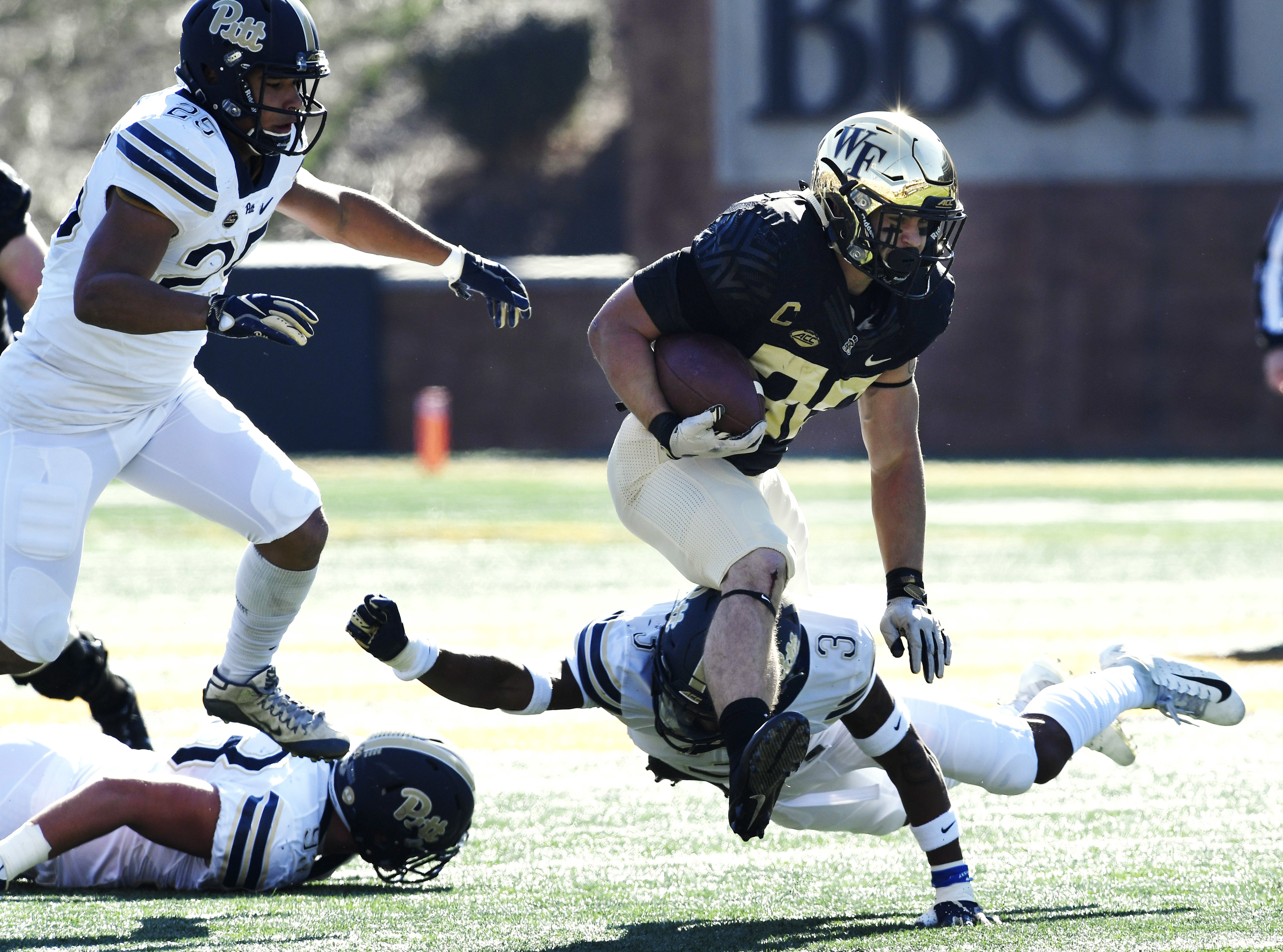 Pitt clinches 1st ACC title game berth by beating Wake 34-13