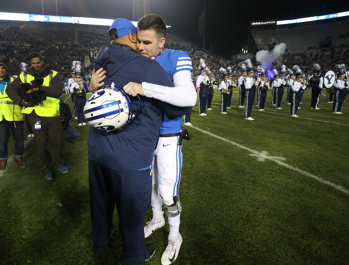 Brigham Young Cougars head coach Kalani Sitaki hugs Brigham Young Cougars quarterback Tanner Mangum (12) as part of senior night in Provo on Saturday, Nov. 17, 2018. (Photo: Jeffrey D. Allred, Deseret News)