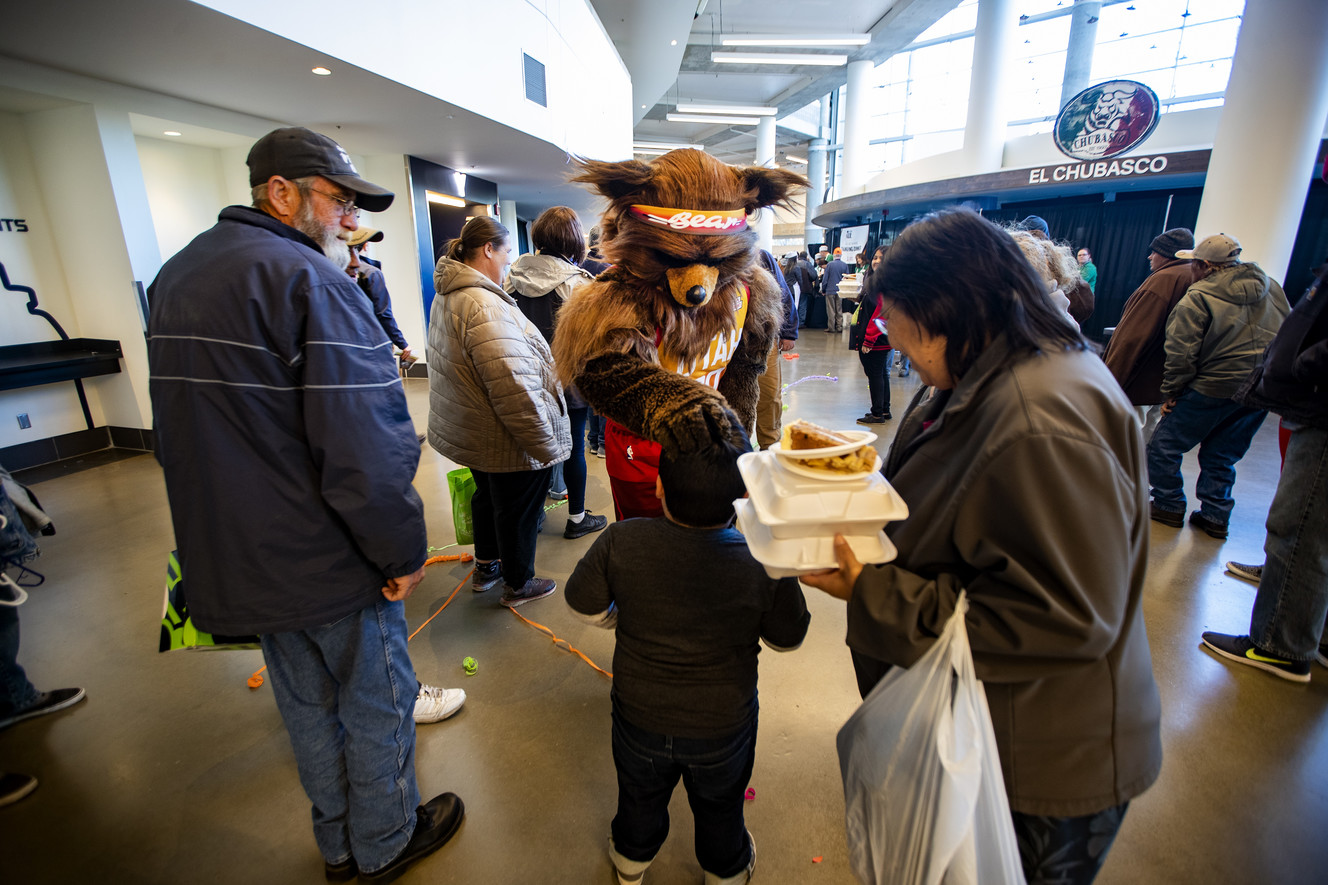 The Jazz Bear greets fans during the 20th annual We Care - We Share Thanksgiving Meal for local homeless and low-income individuals at the Vivint Smart Home Arena in Salt Lake City on Monday, Nov. 19, 2018. The event was hosted by the Utah Jazz organization and the Larry H. Miller Group of Companies. (Photo: Scott G Winterton, KSL)