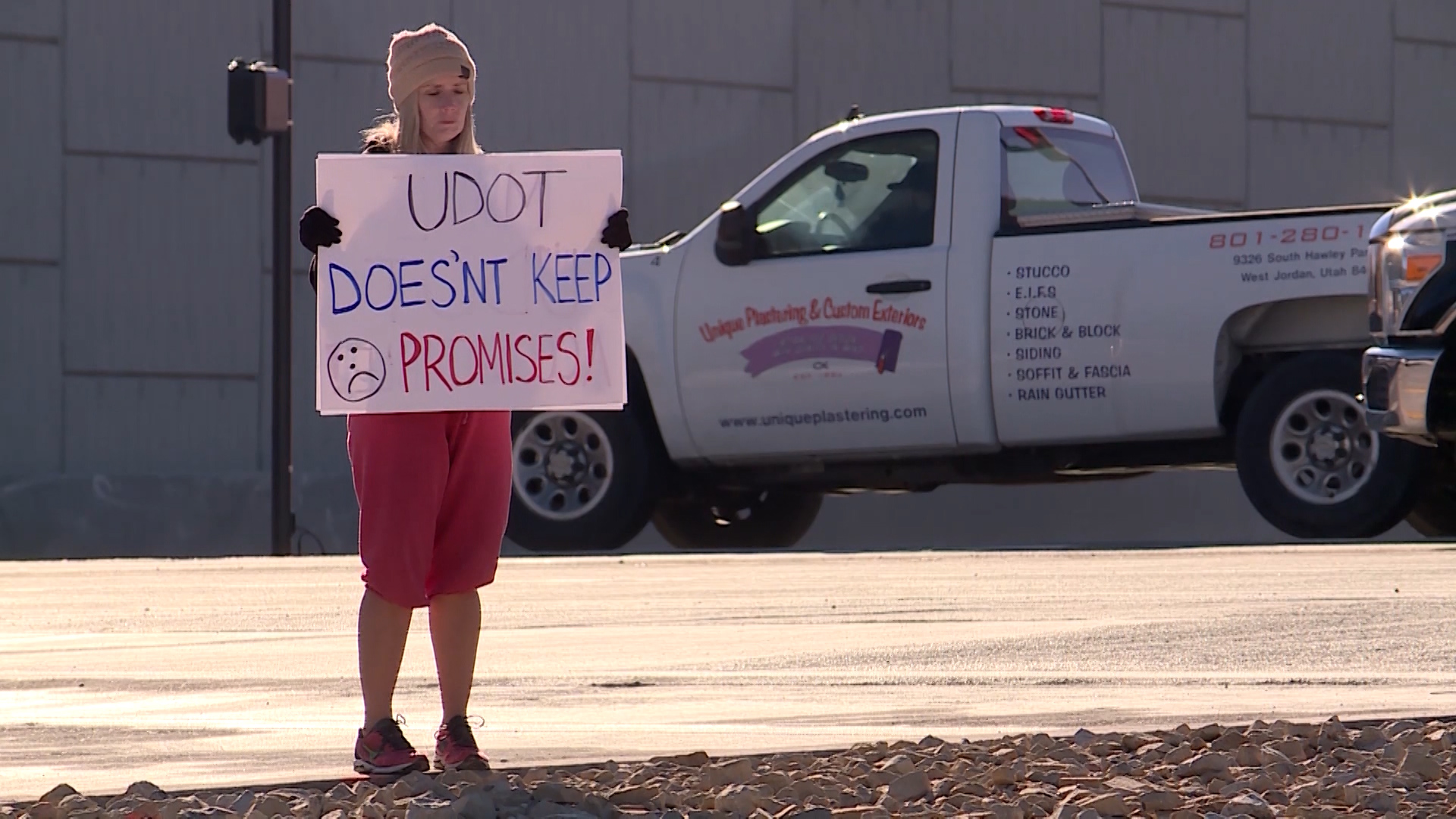 Tiffany Skelton, who lives near Bangerter Highway's 9000 South interchange, says Utah Department of Transportation officials broke their promise and failed to build a tall enough wall between her neighborhood and the highway. (Photo: Jay Szymanik, KSL TV)