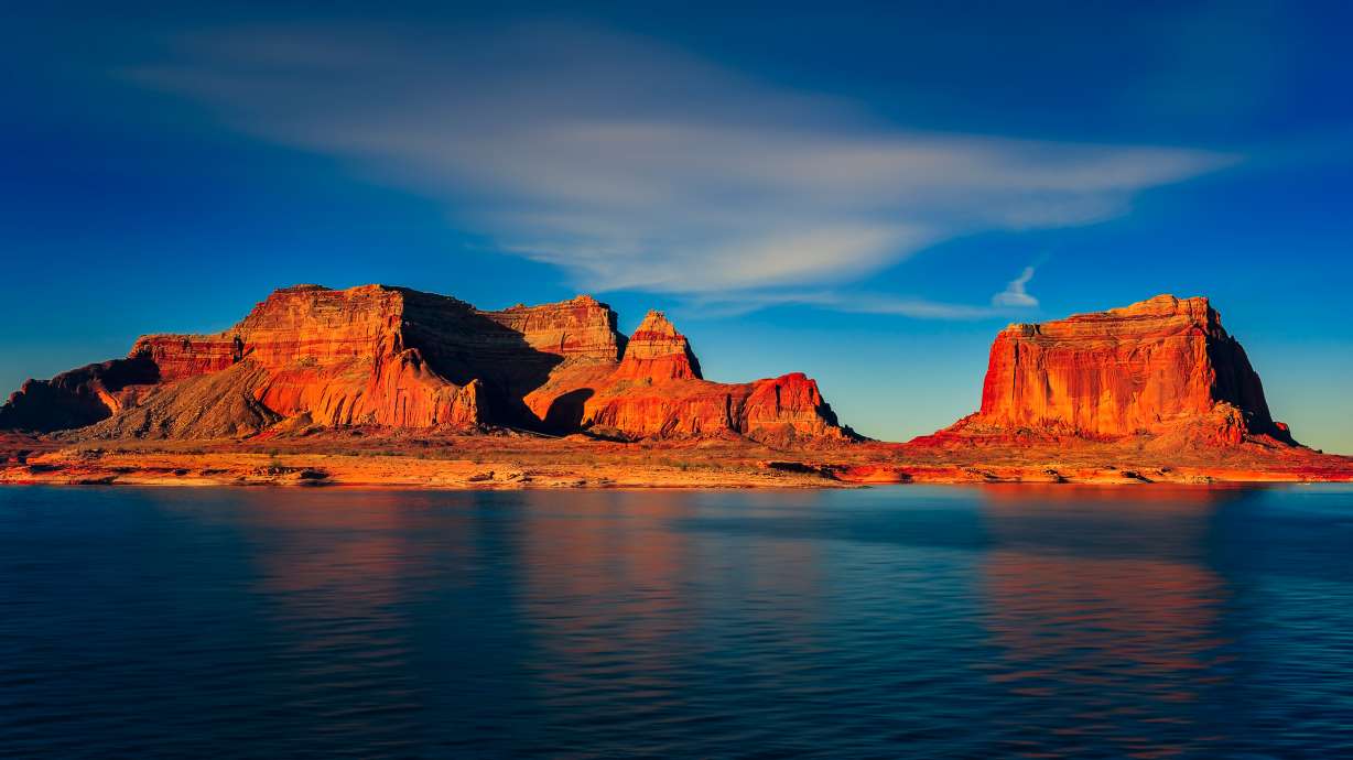 A man drowned after rescuing his struggling child in Lake Powell Thursday.