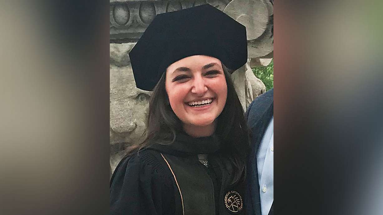 This May 2018 family photo provided by Brian Less shows his daughter Dayna Less at her graduation from Purdue University. Dayna was one of three people fatally shot by gunman, Juan Lopez, at Chicago's Mercy Hospital on Monday, Nov. 19. (Brian Less via AP)
