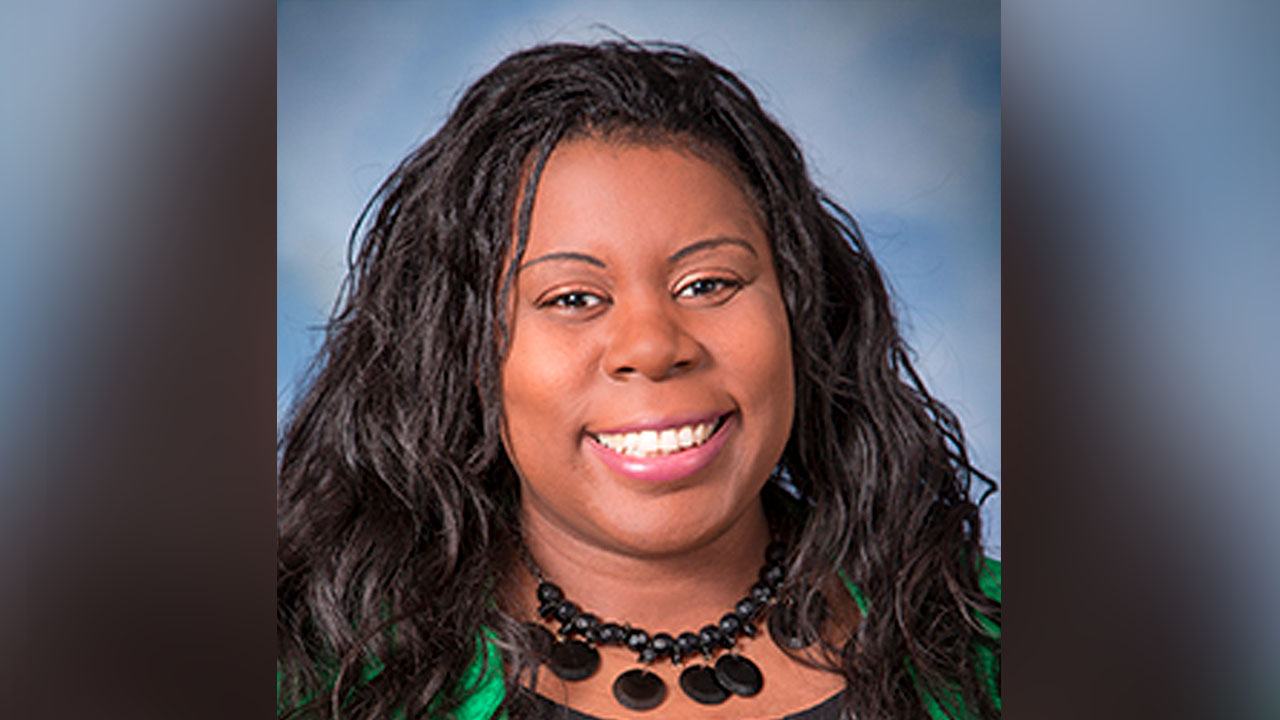 In this September 2017 photo provided by Monte Gerlach Photography Dr. Tamara O'Neal poses for a photo. O'Neal, an emergency room physician at Mercy Hospital in Chicago, was shot and killed by a gunman outside the hospital Monday, Nov. 19, 2018. (Monte Gerlach Photography via AP)