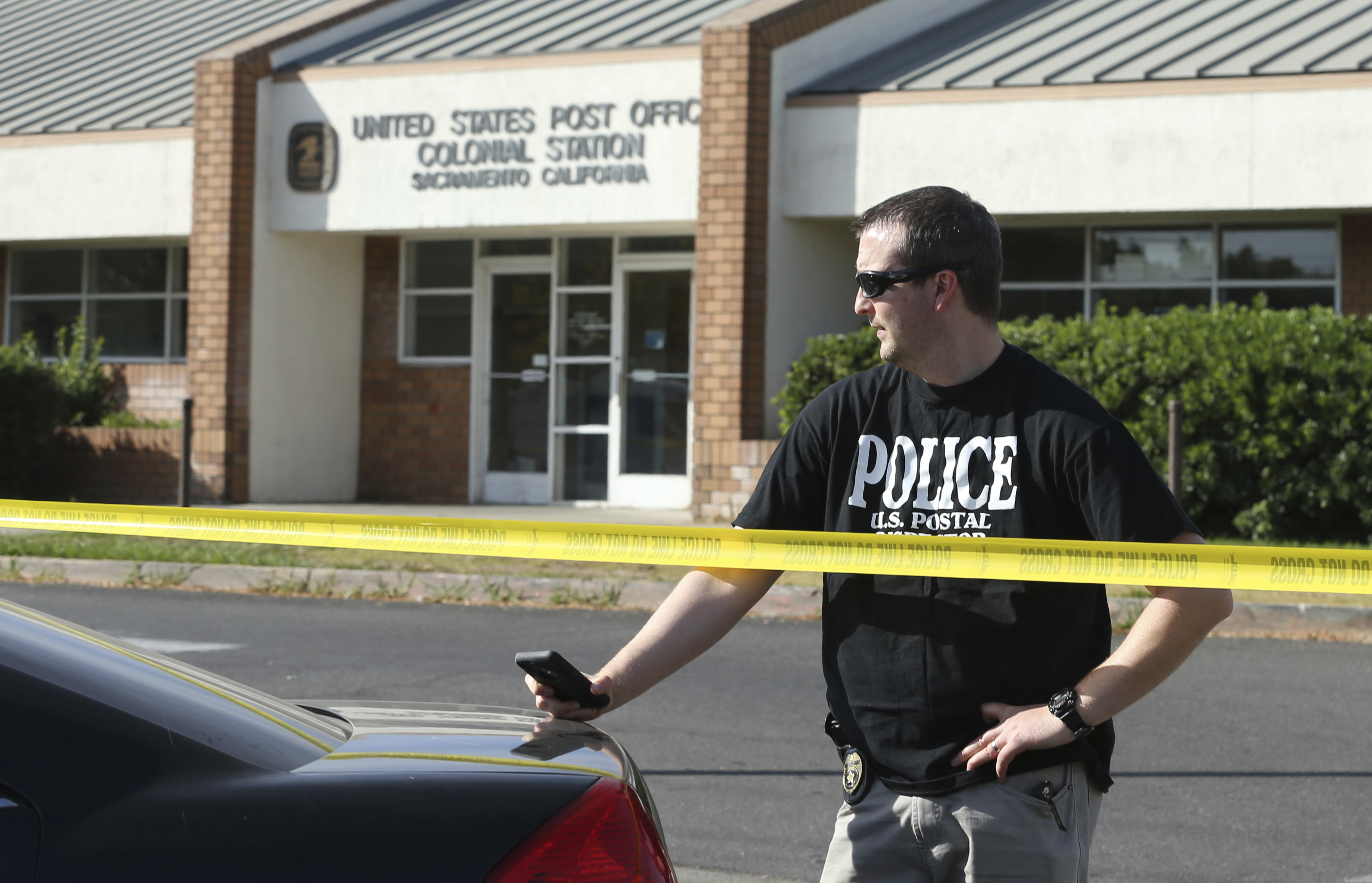 A United States Postal inspector stands behind yellow police tape outside the Colonial Station post office where a suspicious package addressed to U.S. Sen. Kamala Harris, a California Democrat, was found Friday, Oct. 26, 2018, in Sacramento, Calif. (Rich Pedroncelli, AP Photo, File)