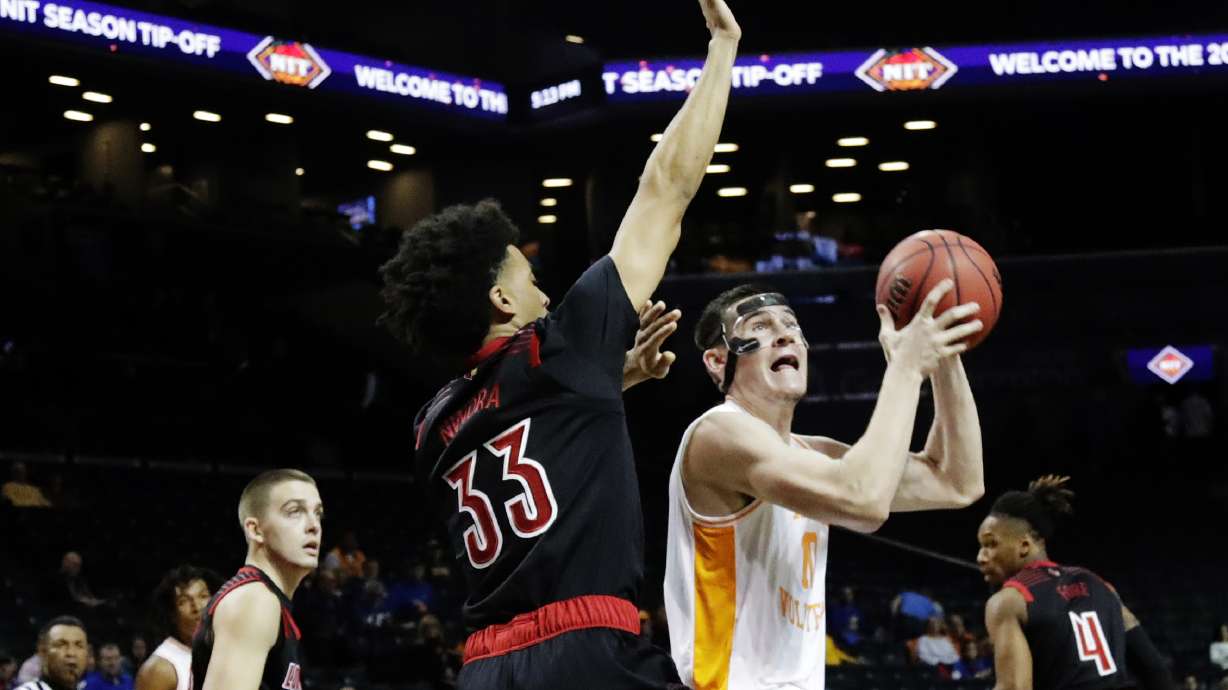 The Latest: No. 2 Kansas rallies past Marquette 77-68