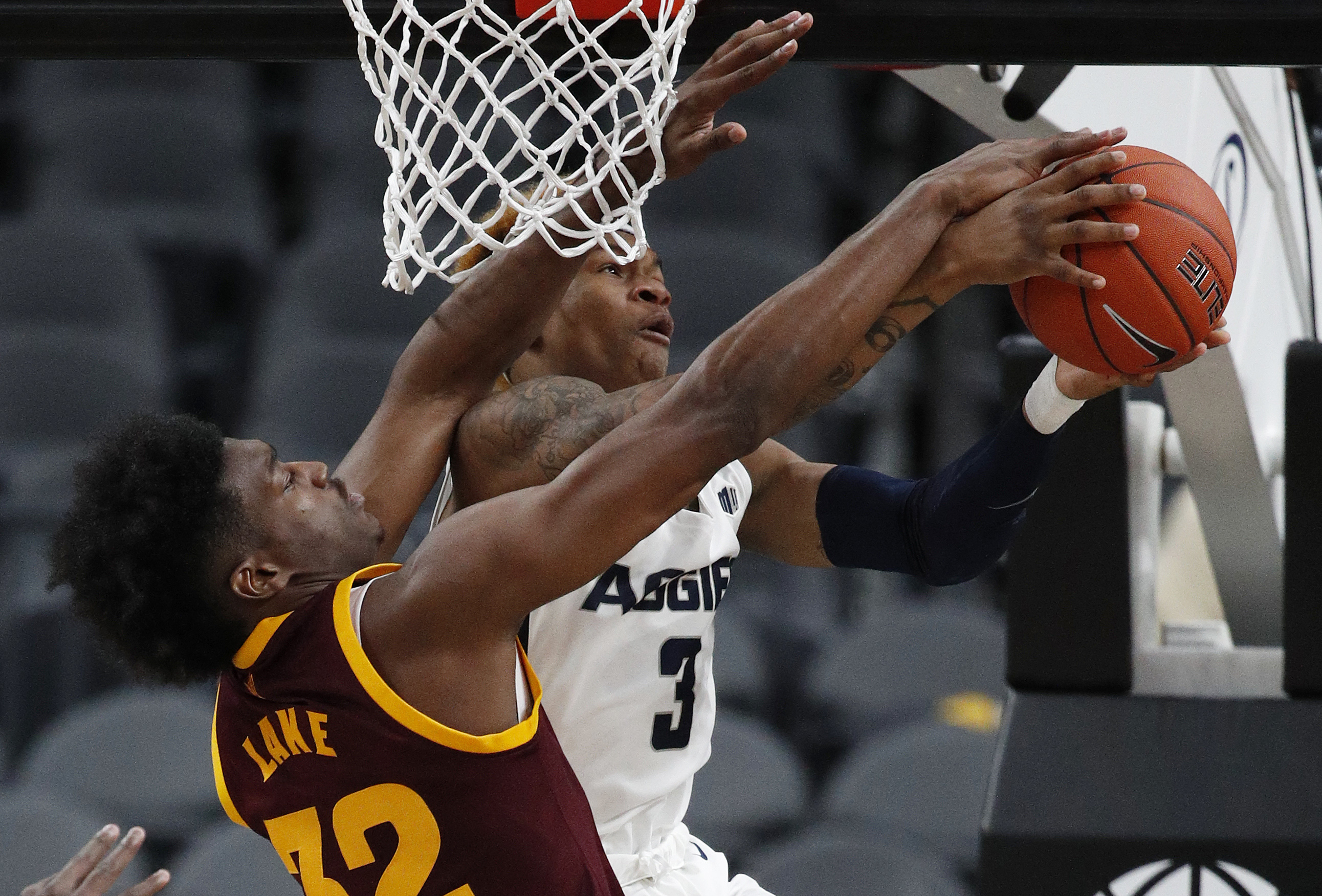 Utah State's John Knight III (3) tries to shoot around Arizona State's De'Quon Lake during the second half of an NCAA college basketball game Wednesday, Nov. 21, 2018, in Las Vegas. (Photo: John Locher, AP)