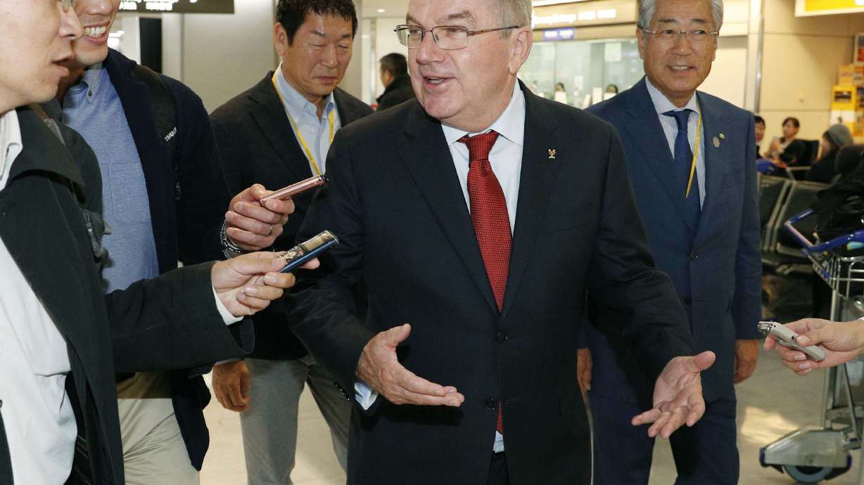 IOC's Bach and Abe make brief visit to Fukushima region