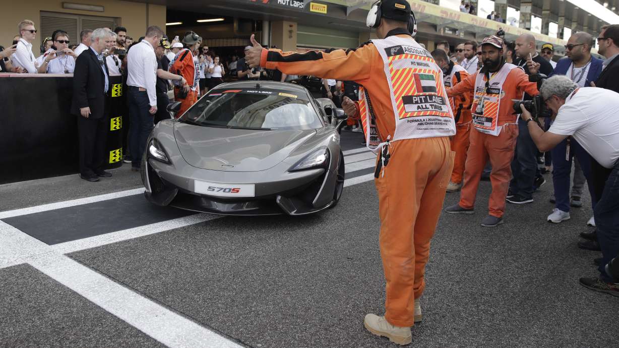 Racing greats Alonso and Johnson drive together in Abu Dhabi