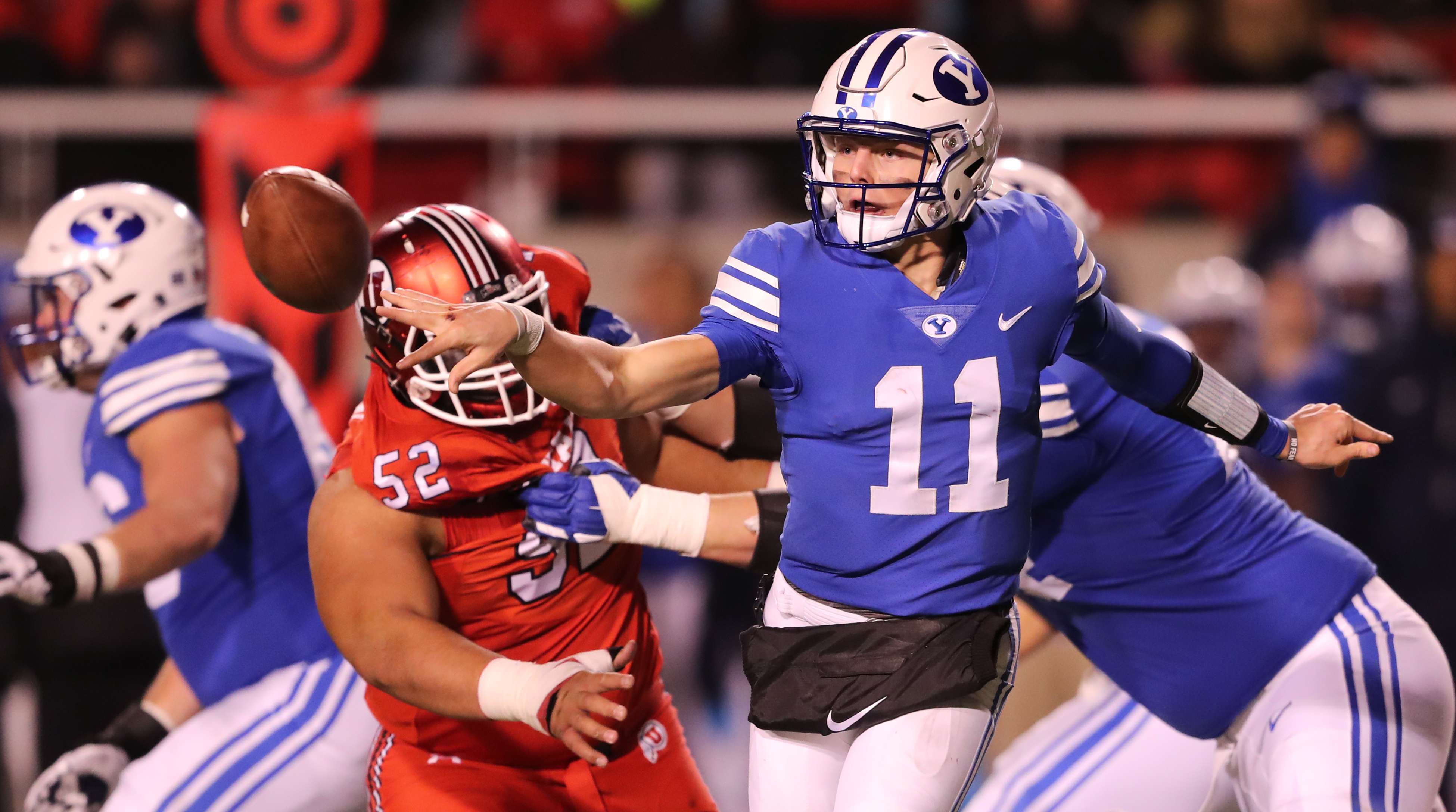 BYU quarterback Zach Wilson (11) pitches the ball as the rush moves in on him. BYU and Utah played at Rice Eccles Stadium in Salt Lake City on Saturday, Nov. 24, 2018. Utah won 35-27. (Photo: Scott G Winterton, KSL)