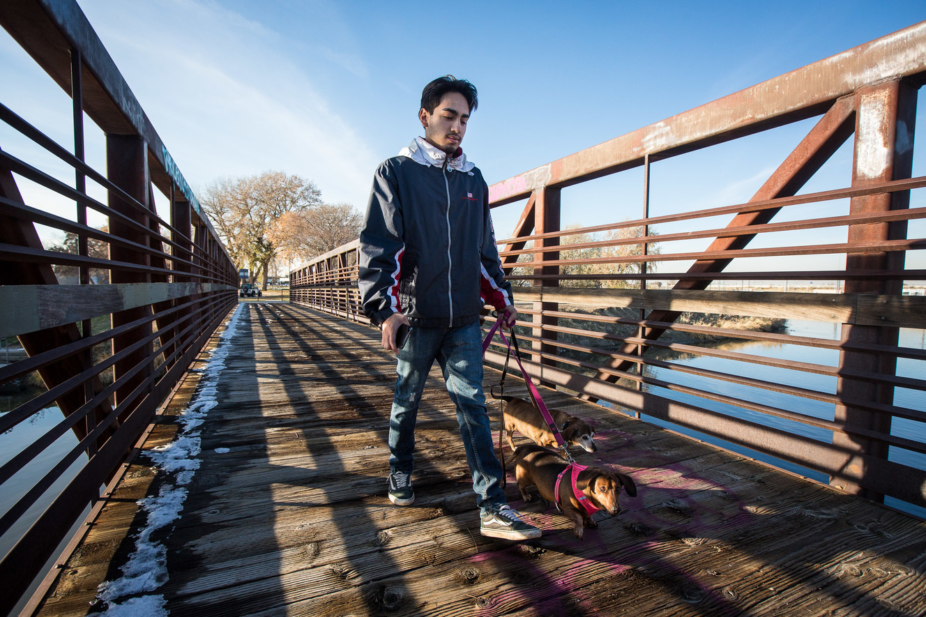 Fernando Lopez walks his two dogs, Milo and Hershey, along the Jordan River Parkway Trail in West Valley City on Monday, Nov. 26, 2018. A coalition of city and county leaders announced Monday they're taking the next steps to form the Jordan River Park, with boundaries from state Route 201 to about 4500 South along the river, will prioritize preserving the Jordan River Parkway's natural habitat while creating more recreation opportunities and better access for Salt Lake County families. (Photo: Qiling Wang, KSL)
