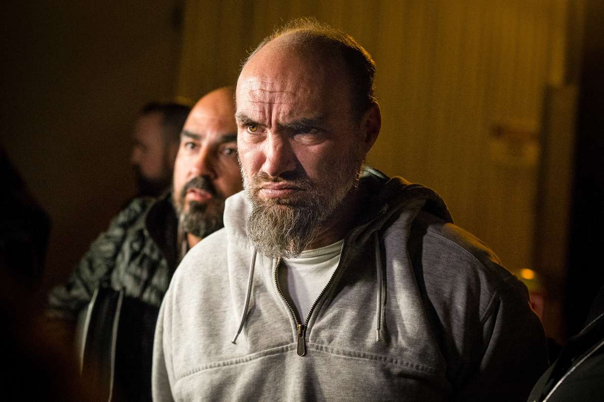 Jeffery Black, 43, arrested for investigation of murder in the death of South Salt Lake police officer David Romrell, answers questions from reporters as he is escorted out of the Salt Lake County Sheriff's Office in Salt Lake City on Monday, Nov. 26, 2018. (Photo: Qiling Wang, KSL)