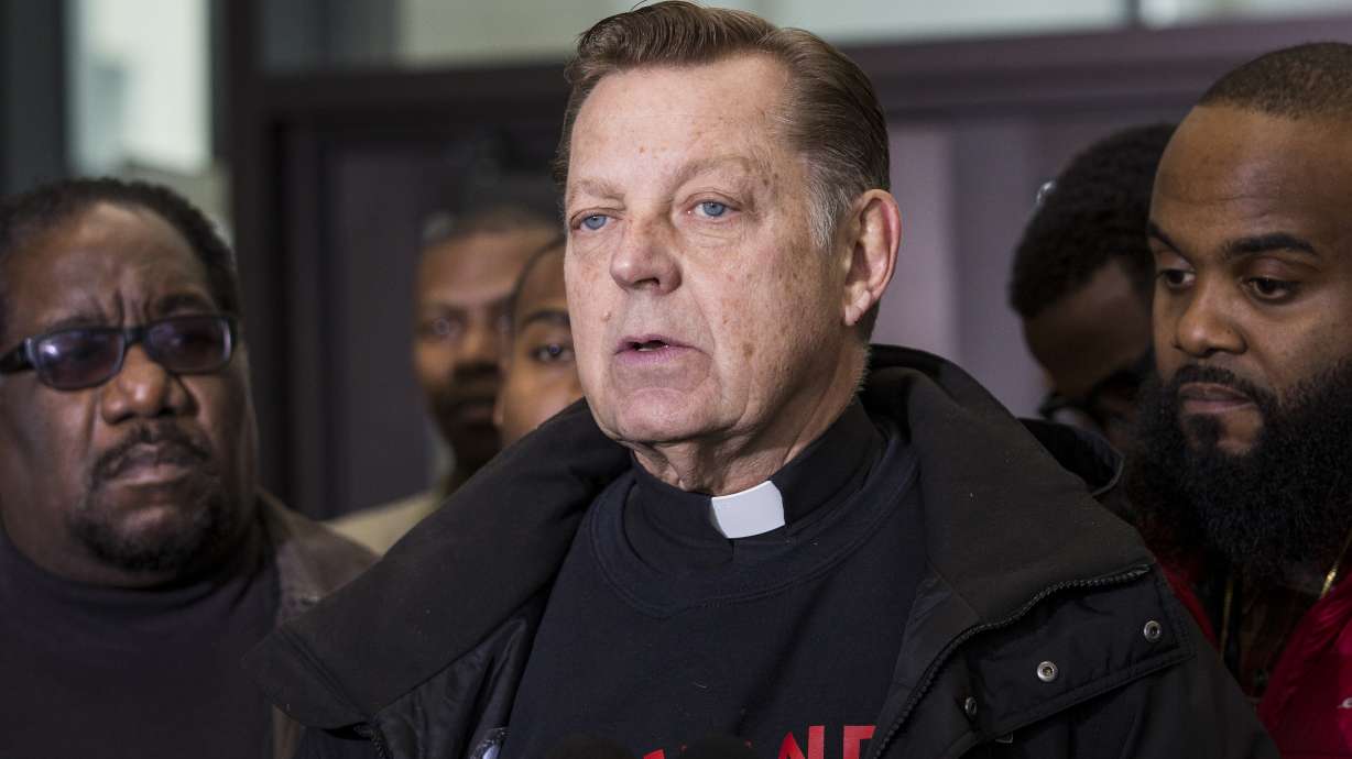 The Latest: Witness: Cop said teen lunged before shooting