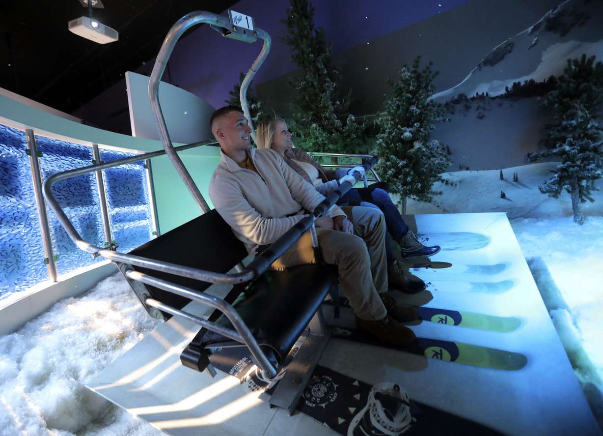 Aaron Eskine and Megan Eskine try virtual speed-flying at the Alf Engen Ski Museum at the Utah Olympic Park in Park City on Tuesday, Nov. 27, 2018. (Photo: Kristin Murphy, KSL)