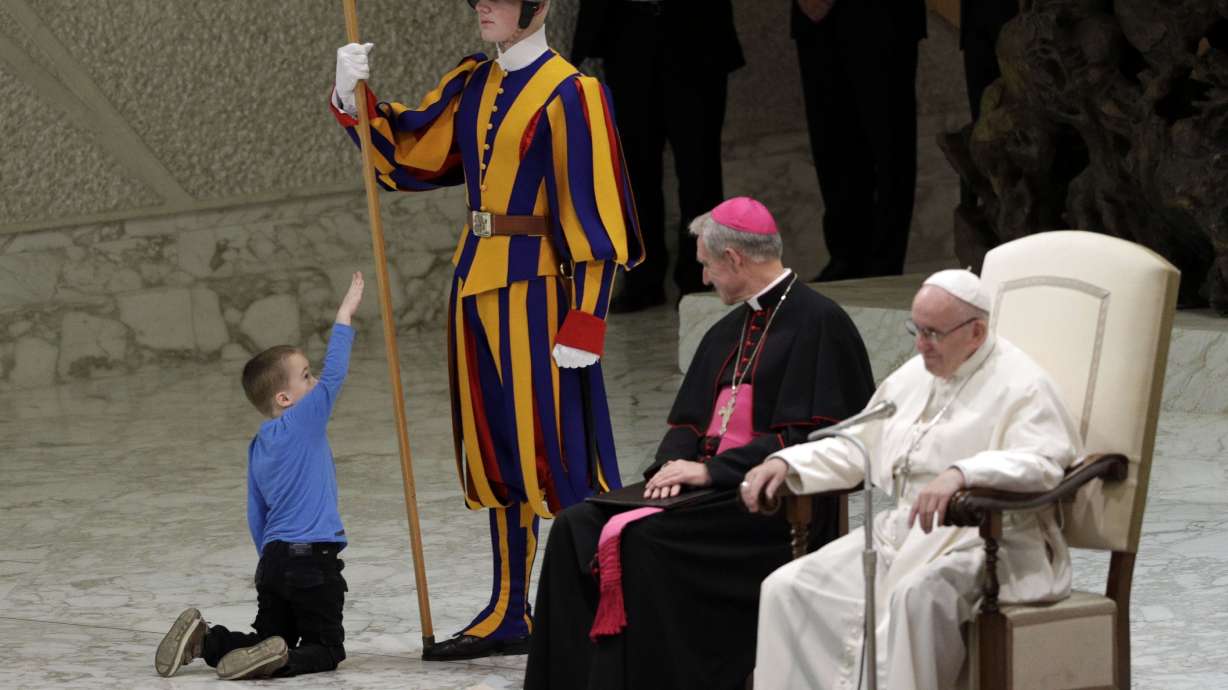 Pope charmed by 'undisciplined' disabled child