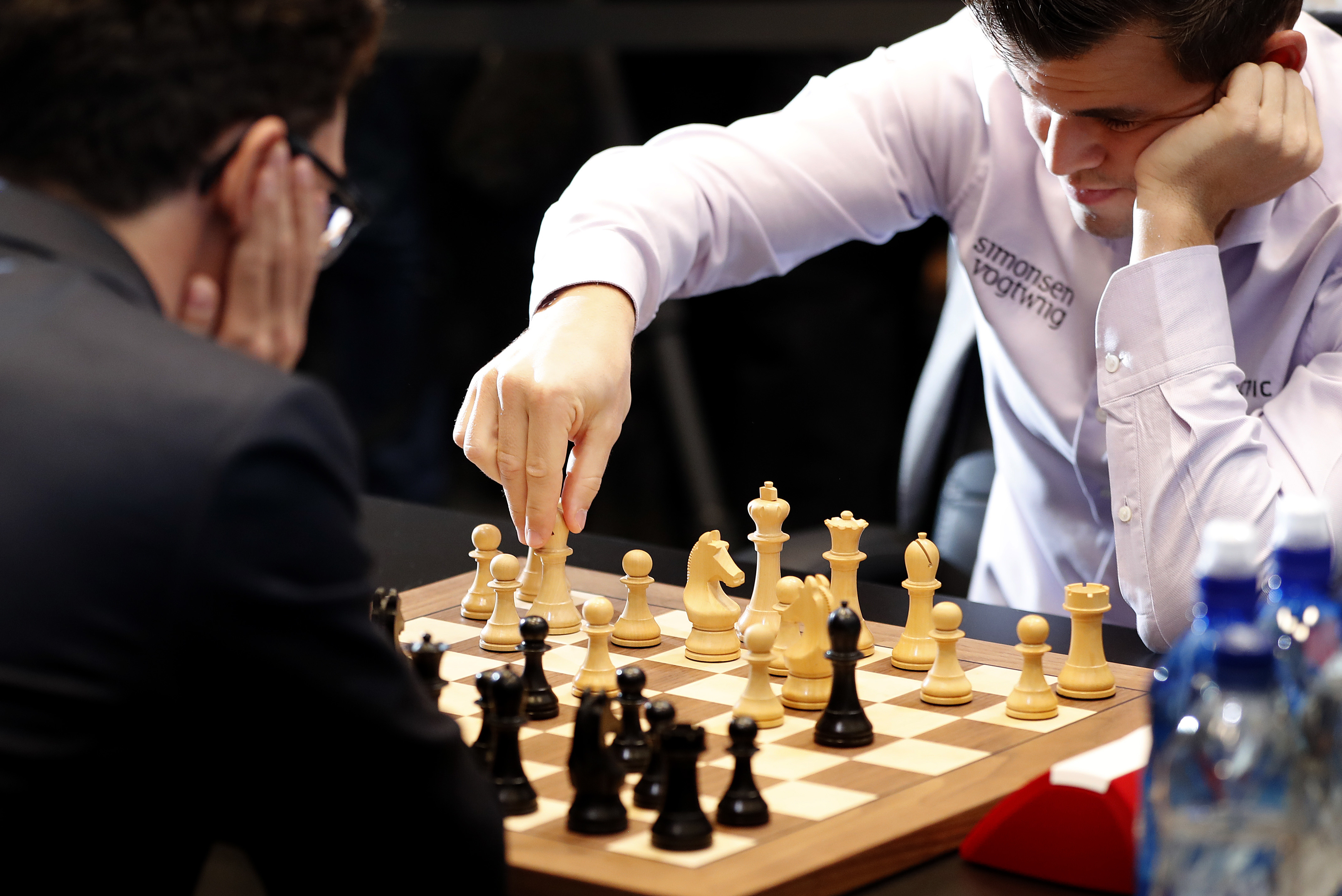 Norway's Carlsen beats Caruana to defend chess world title