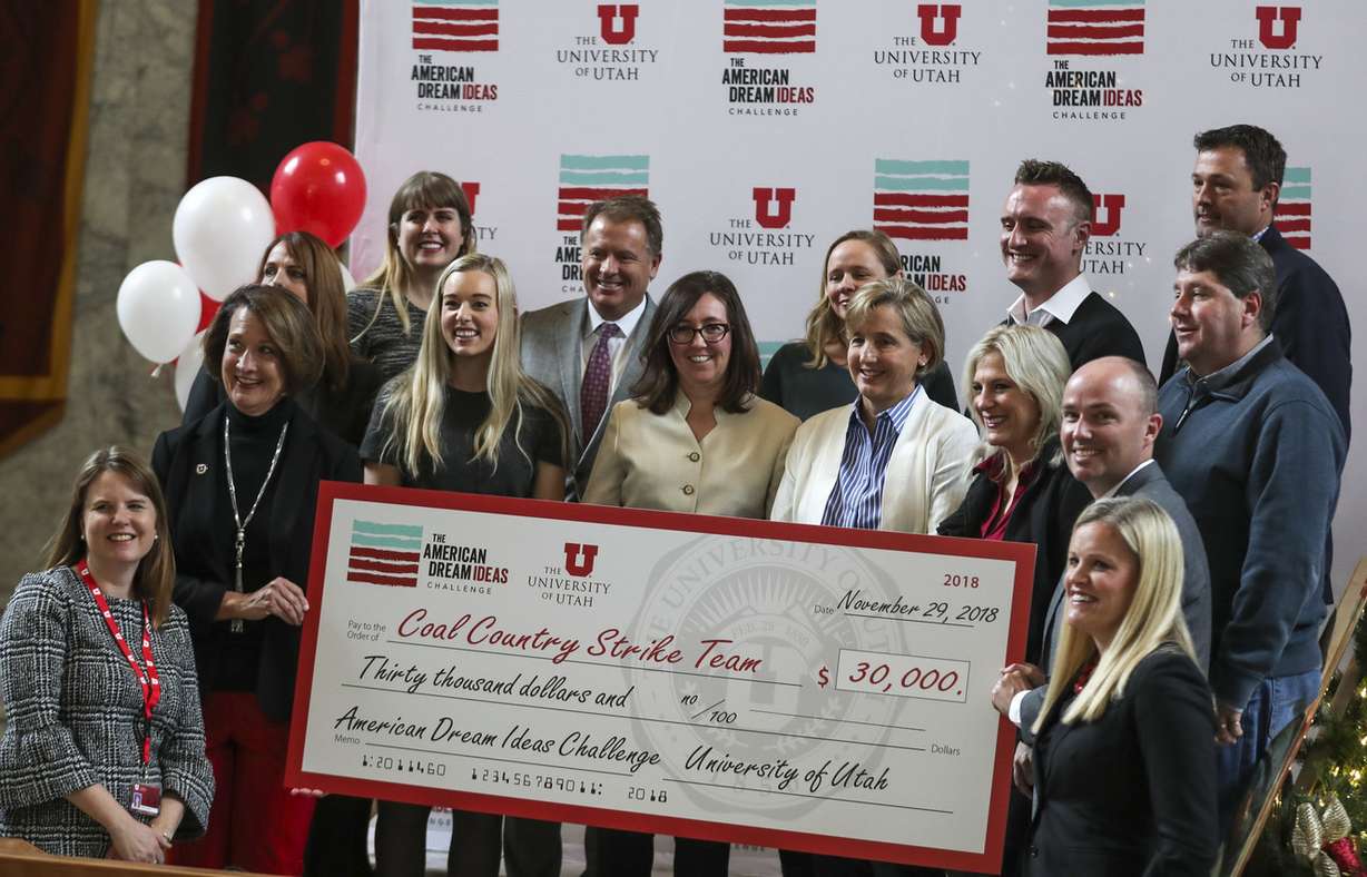 Members of the Utah Coal Country Strike Team accept a check for being one of three finalists in the American Dream Ideas Challenge during ceremony at the University of Utah in Salt Lake City on Thursday, Nov. 29, 2018. (Photo: Steve Griffin, KSL)