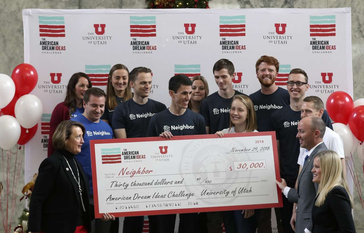 Team members of Neighbor accept a check for being one of three finalists in the American Dream Ideas Challenge during ceremony at the University of Utah in Salt Lake City on Thursday, Nov. 29, 2018. (Photo: Steve Griffin, KSL)