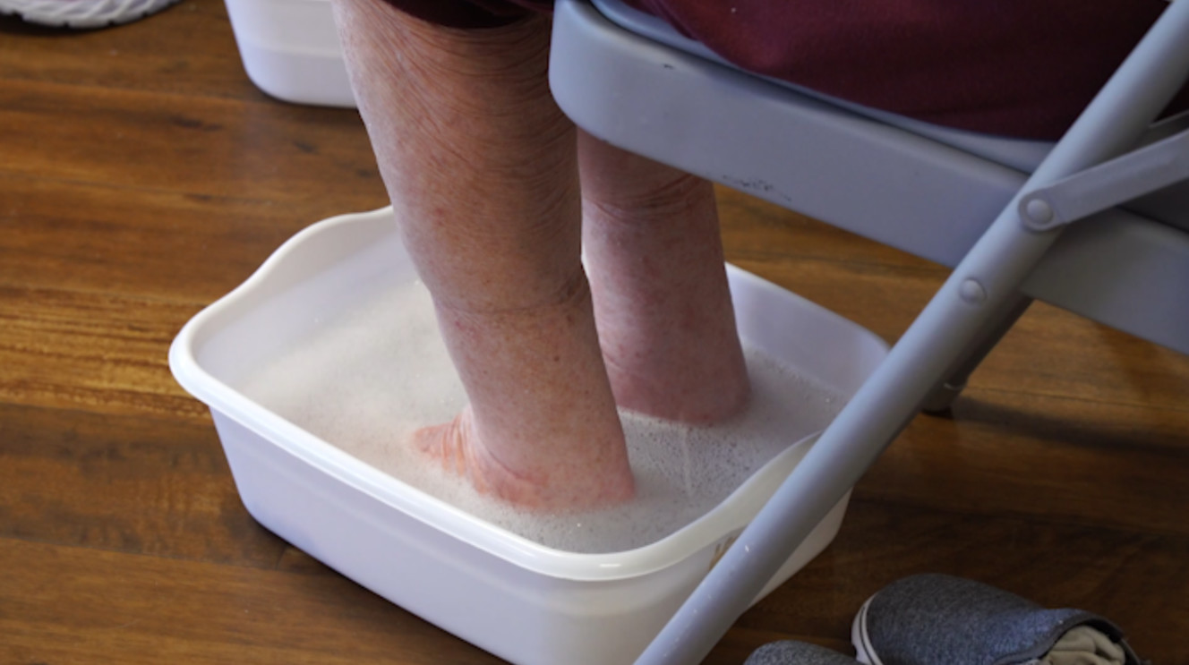 Jeanne Clement soaks her clients feet before clipping their toenails. (Photo: KSL TV)
