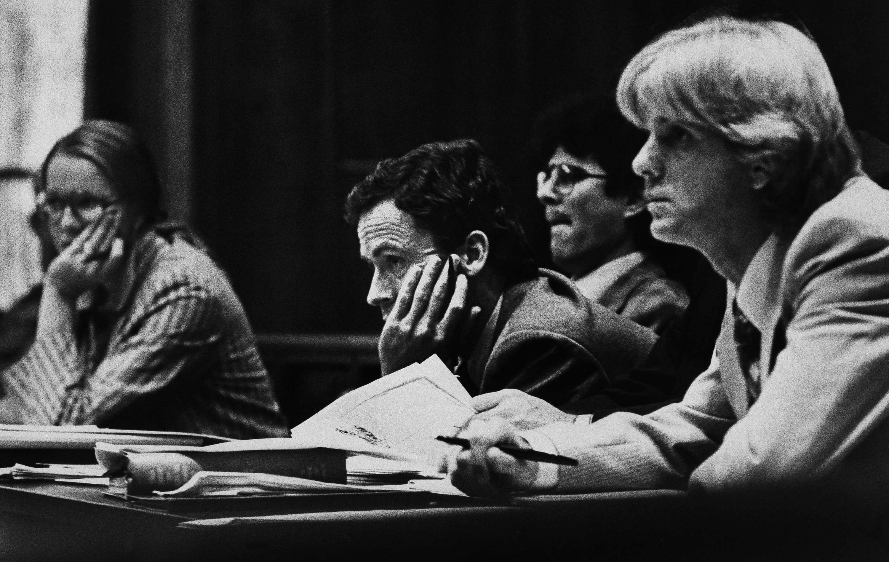 Theodore Bundy, center, is flanked by members of his defense team as potential jurors are questioned during the second day of Bundy's murder trial, June 26, 1979 in Miami. Although many persons were questioned, only several have been tentatively selected as jurors. Most often those questioned were quite familiar with the case. (AP Photo, File)