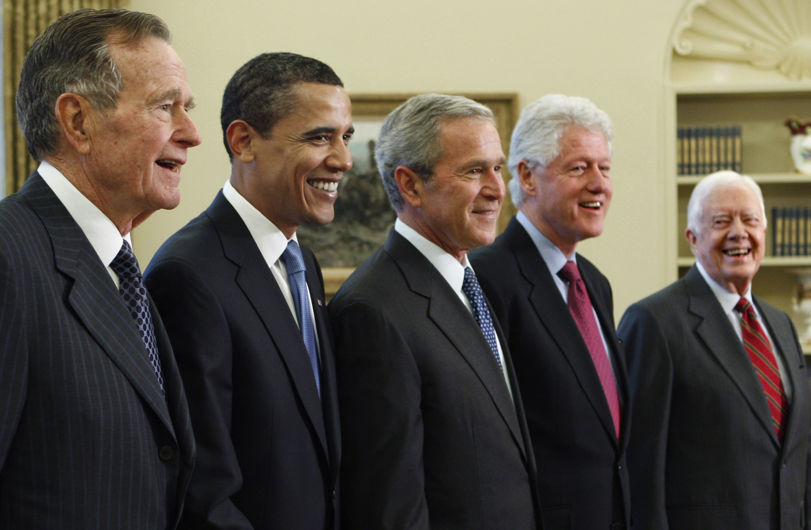 FILE - In this Jan. 7, 2009, file photo, President George W. Bush, center, poses with President-elect Barack Obama, second left, and former presidents, George H.W. Bush, left, Bill Clinton, second right, and Jimmy Carter, right, in the Oval Office of the White House in Washington. Bush has died at age 94. (AP Photo/J. Scott Applewhite, File)