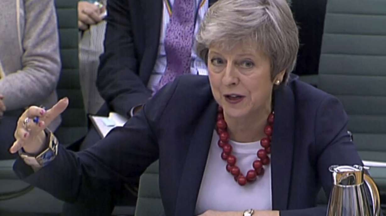 May presses on with Brexit plan after another minister quits