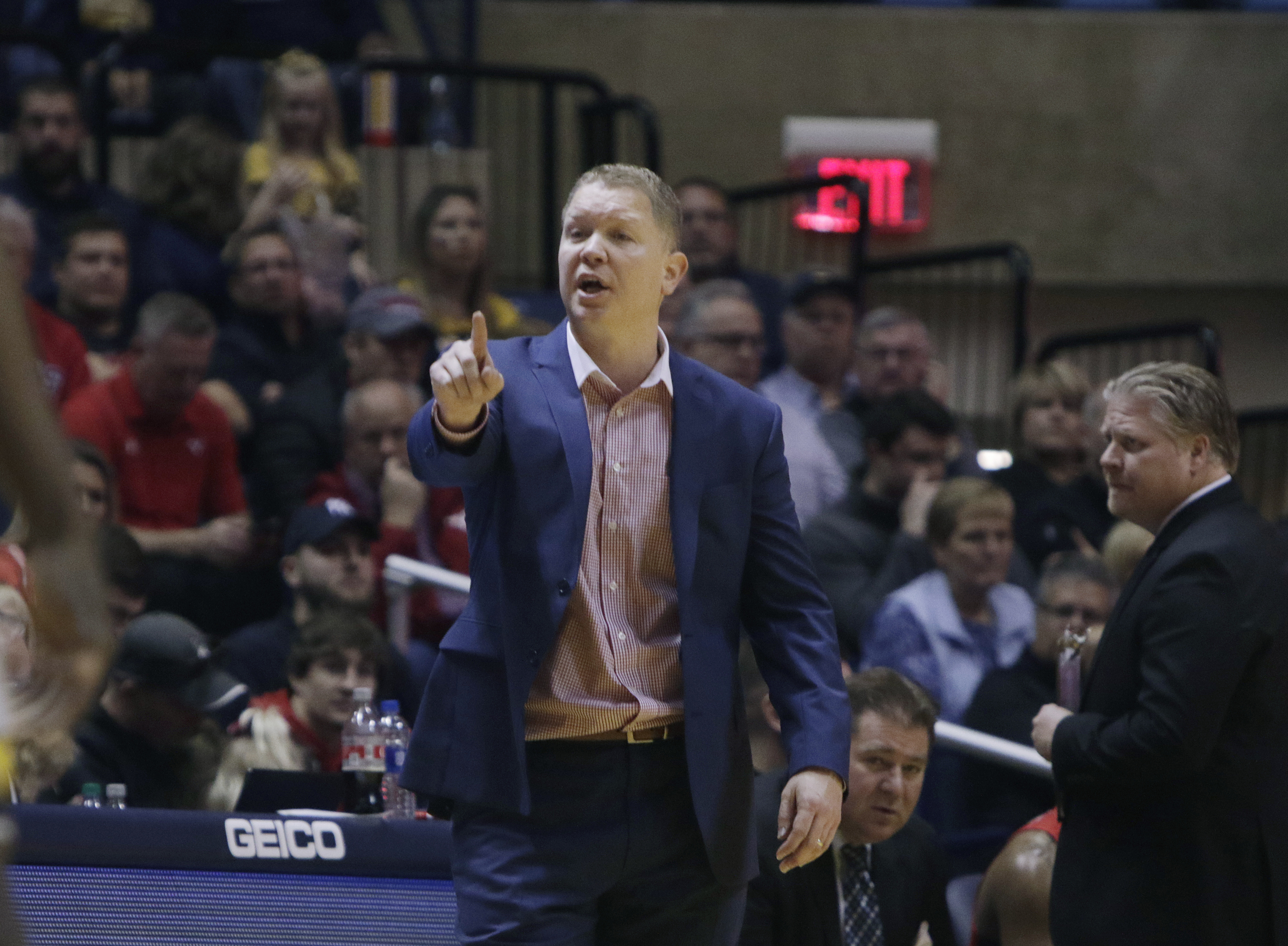 Youngstown State head coach Jerrod Calhoun gives directions to his players during the second half of an NCAA college basketball game against West Virginia, Saturday, Dec. 1, 2018, in Morgantown, W.Va.