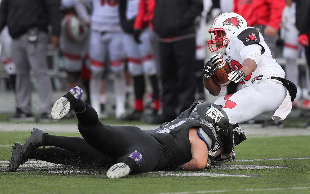 Weber State Wildcats defensive end George Tarlas (44) and Weber State Wildcats safety Brody Burke (31) tackle Southeast Missouri State Redhawks running back Zion Custis (28) in Ogden on Saturday, Dec. 1, 2018. (Photo: Jeffrey Allred, KSL)