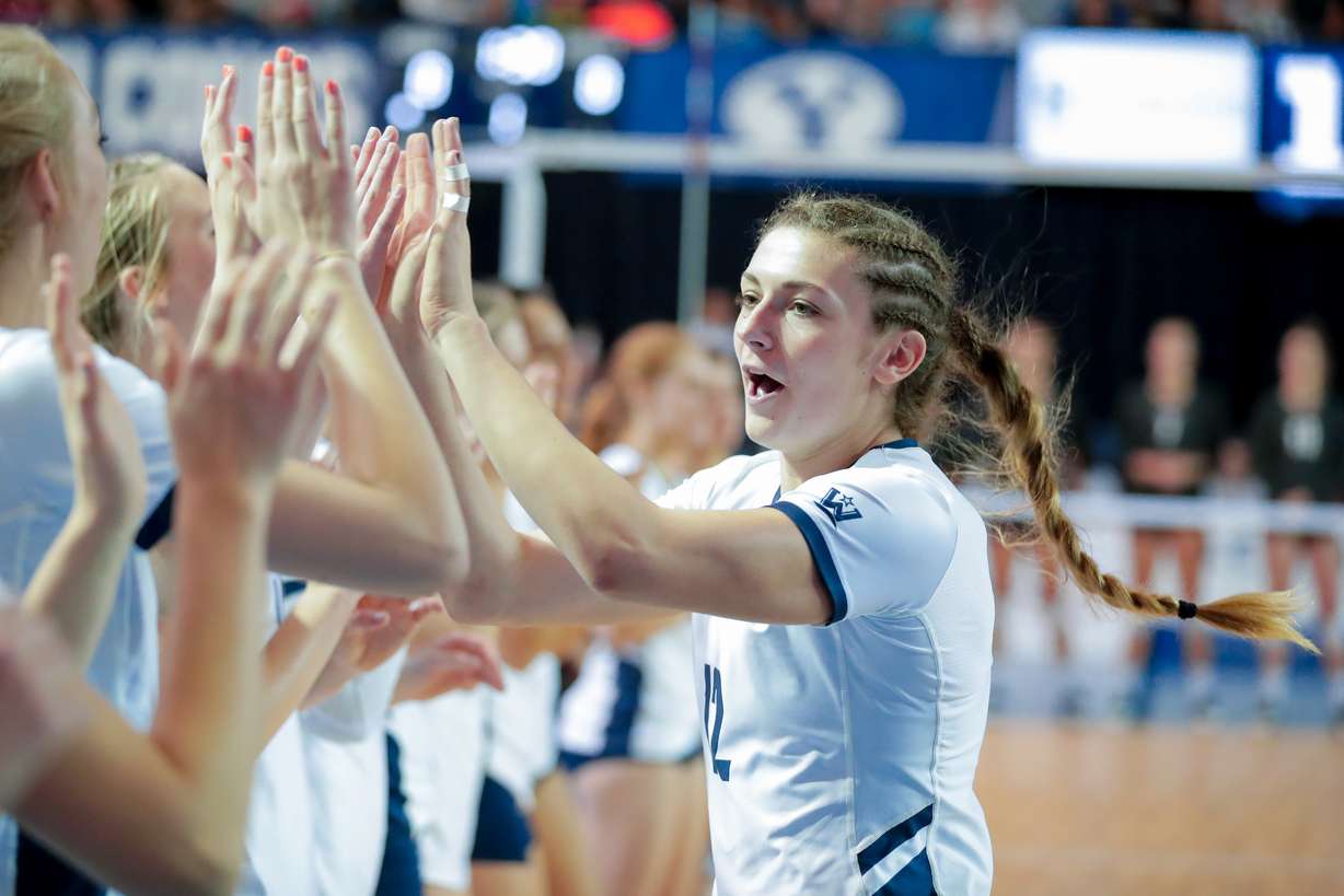 BYU outside hitter Roni Jones-Perry high-fives the crowd after the Cougars' 3-0 sweep of Utah in the second round of the NCAA women's volleyball tournament, Saturday, Dec. 1, 2018 in Provo, Utah. (Photo: Gabriel Mayberry, BYU Photo)