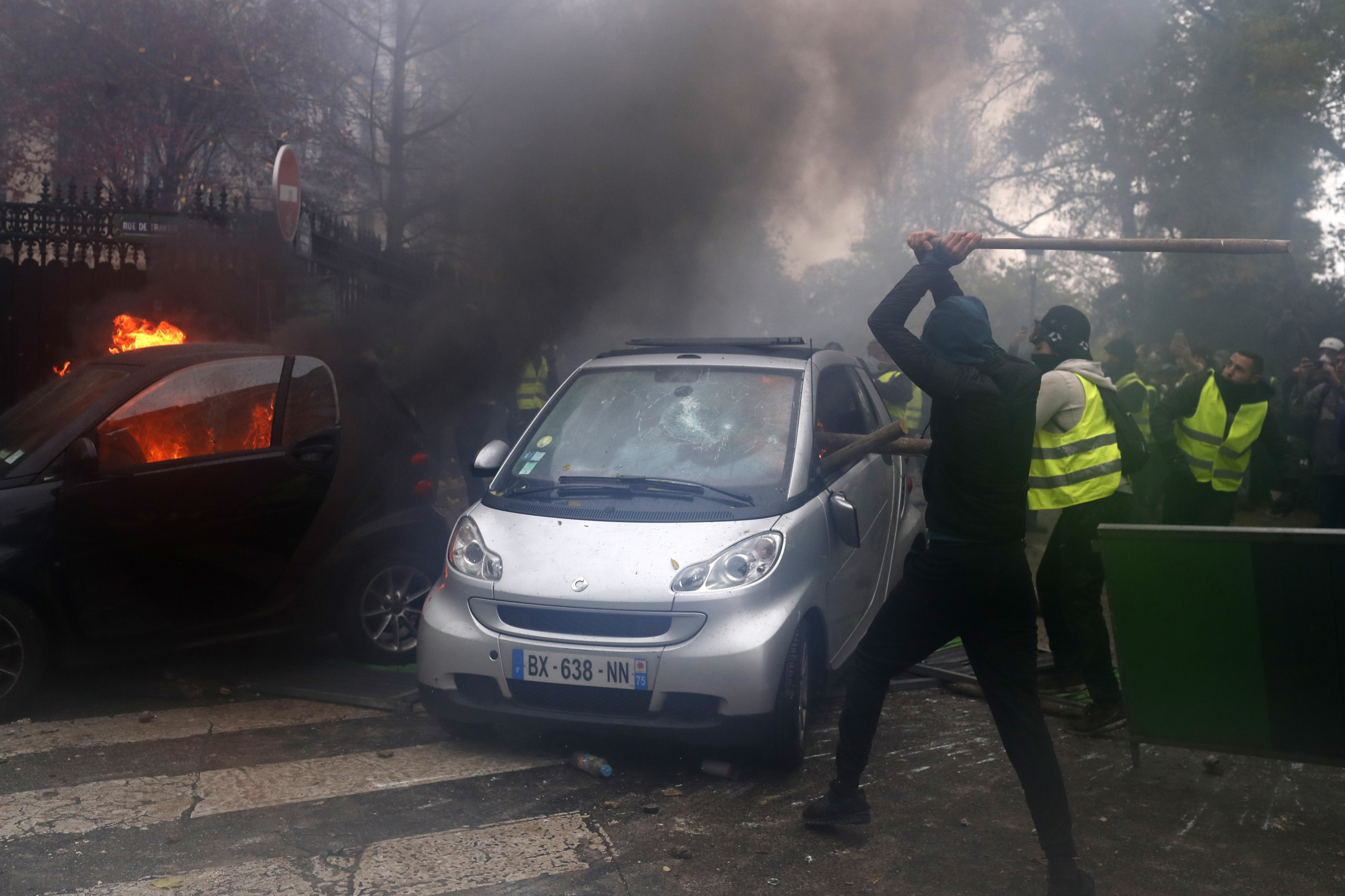 The Latest: Paris police chief says 112 cars torched in riot