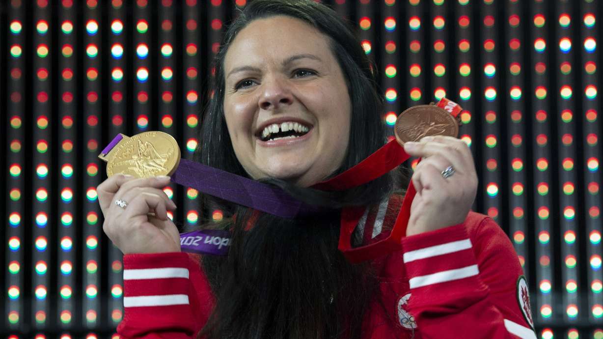 Canadian weightlifter upgraded to Olympic gold, bronze