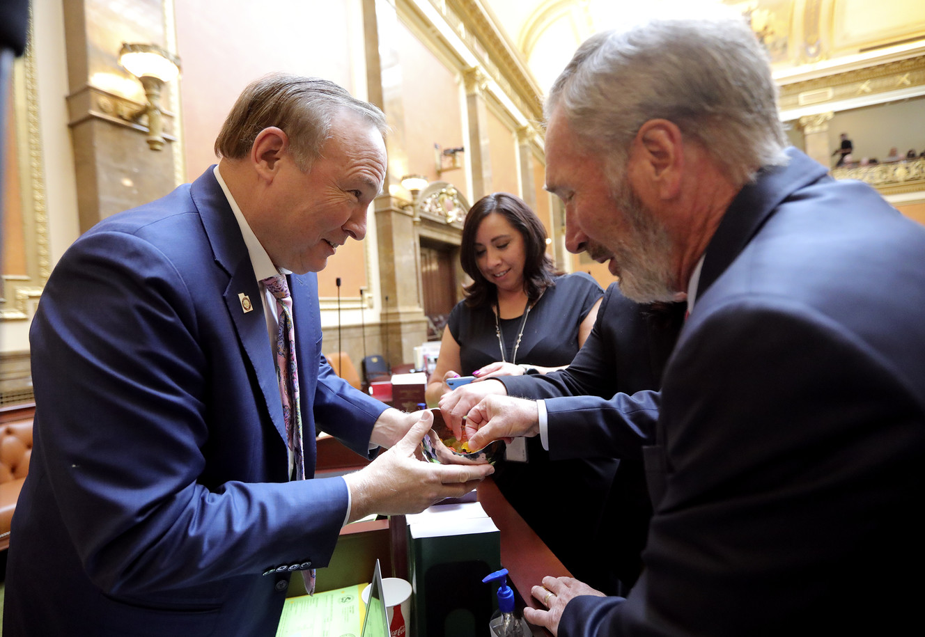 Sen. Jim Dabakis, D-Salt Lake City, hands out gummy candies before a special session of the Utah State Legislature to address the Utah Medical Cannabis Act at the Capitol in Salt Lake City on Monday, Dec. 3, 2018. (Photo: Kristin Murphy, KSL)