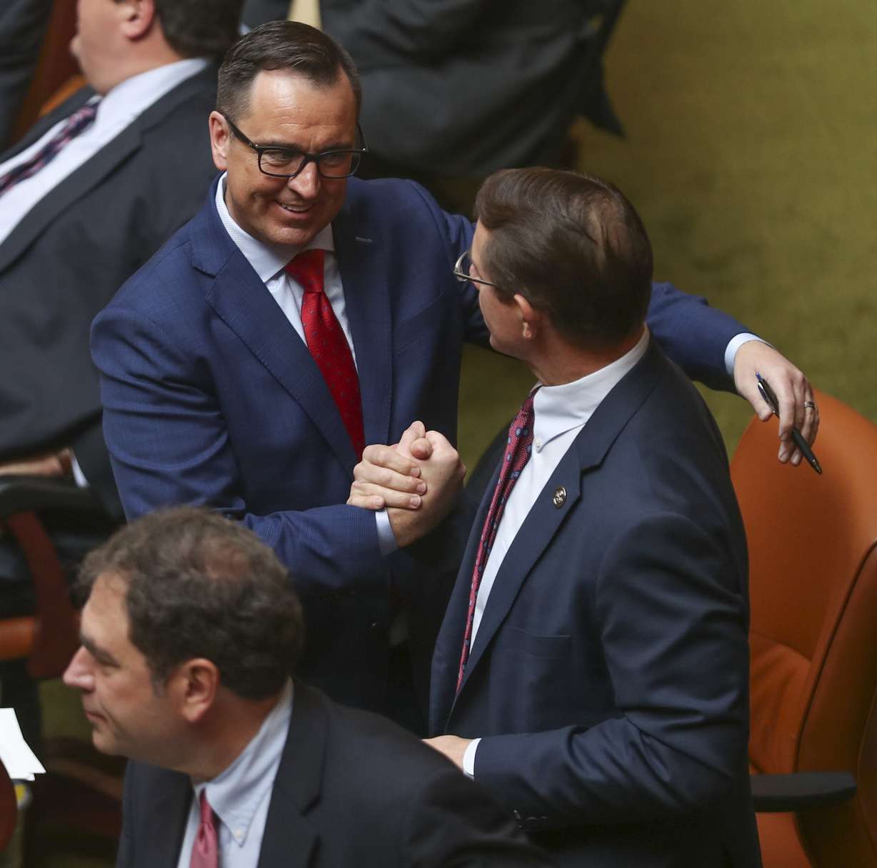 Utah House Speaker Greg Hughes, R-Draper, left, shakes hands with Rep. Ken Ivory, R-West Jordan, after the House passed a wide-ranging medical marijuana bill replacing the ballot initiative that voters approved Nov. 6, 2018, during a special session at the State Capitol in Salt Lake City on Monday, Dec. 3, 2018. (Photo: Steve Griffin, KSL)