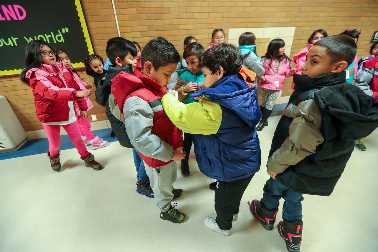 Kids check out their new coats after West Valley City firefighters donated nearly 150 coats to kids at Hillsdale Elementary School in West Valley City, Monday, Dec. 3, 2018.(Photo: Scott G Winterton, KSL)