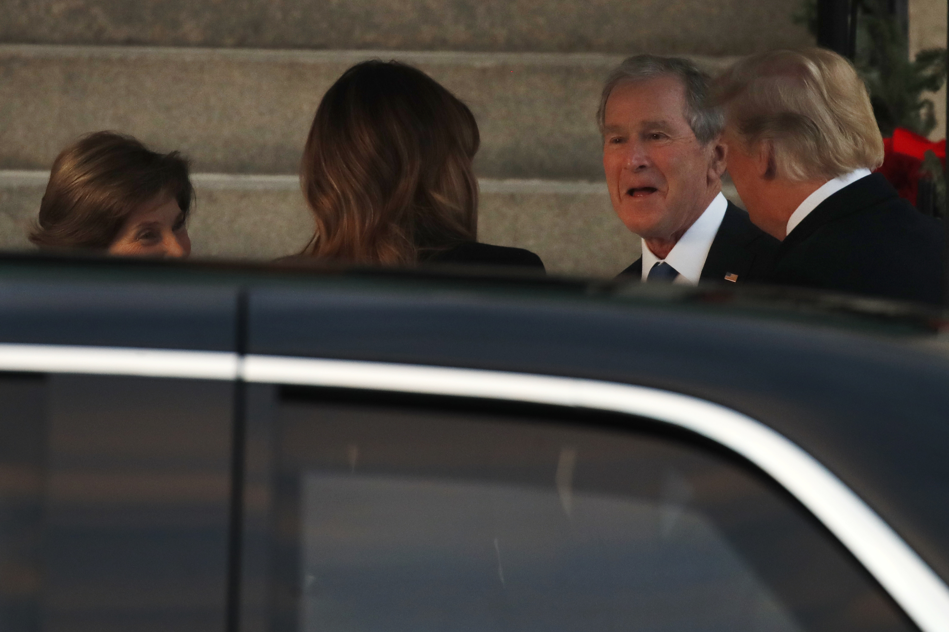 Trump odd man out as presidents assemble for Bush funeral