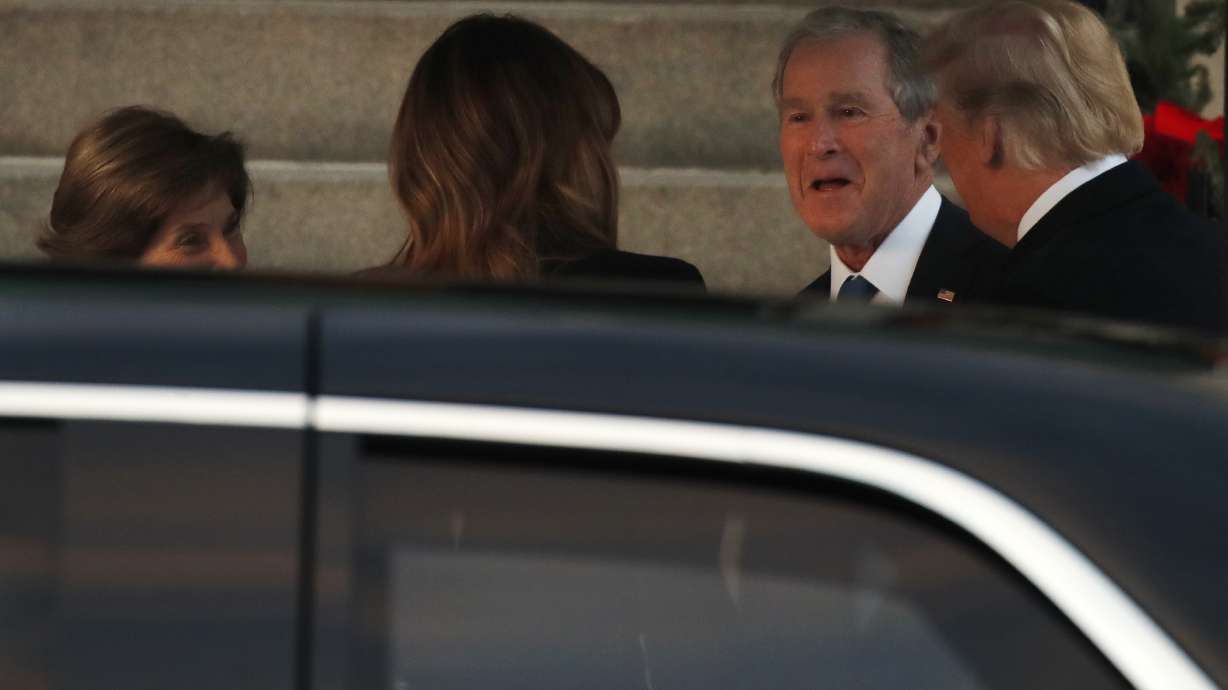 Trump odd man out as presidents assemble for Bush funeral