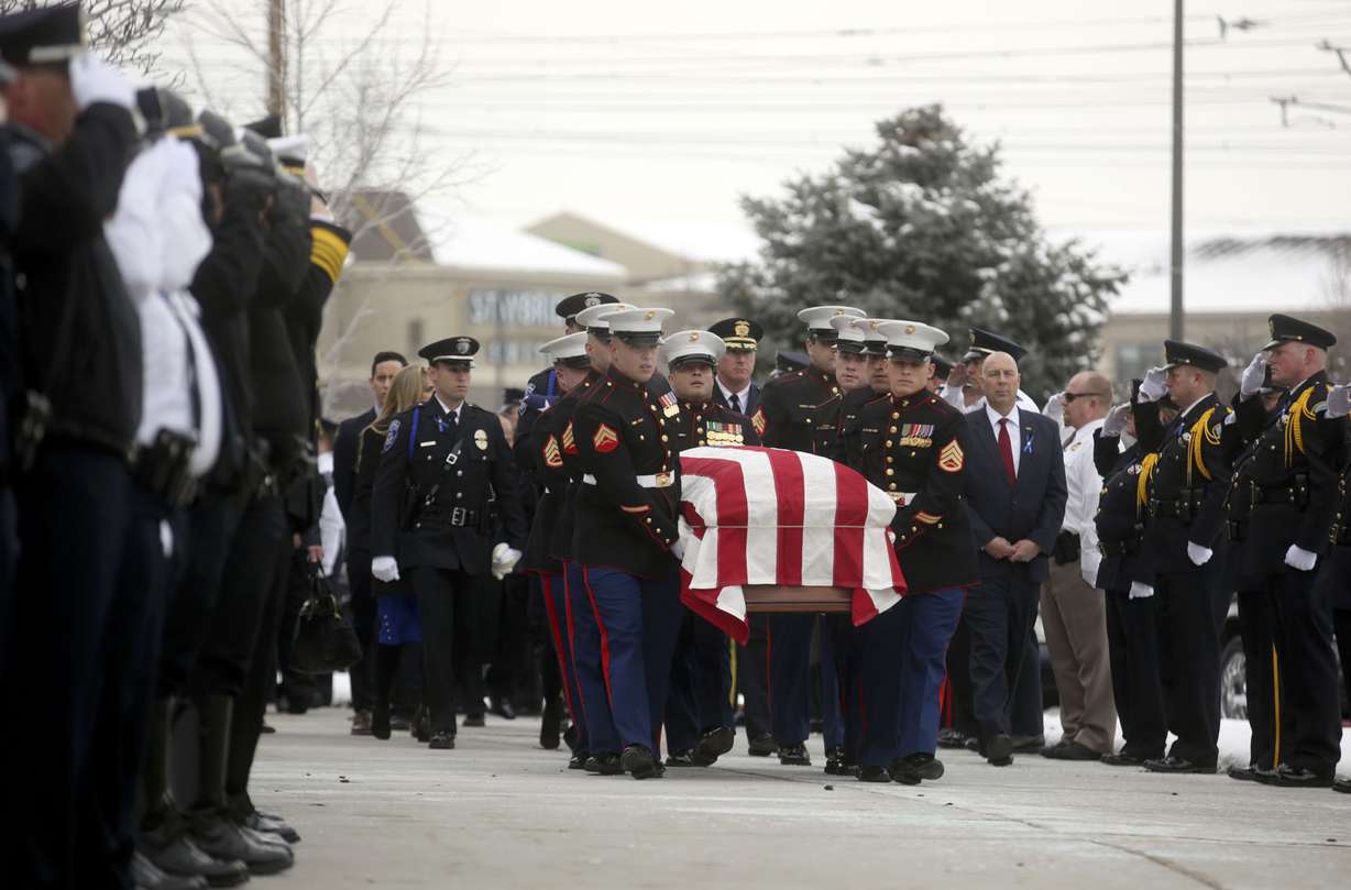 The flag-draped casket of South Salt Lake police officer David Romrell is carried out of the Maverik Center in West Valley City on Wednesday, Dec. 5, 2018. (Photo: Kristin Murphy, KSL)