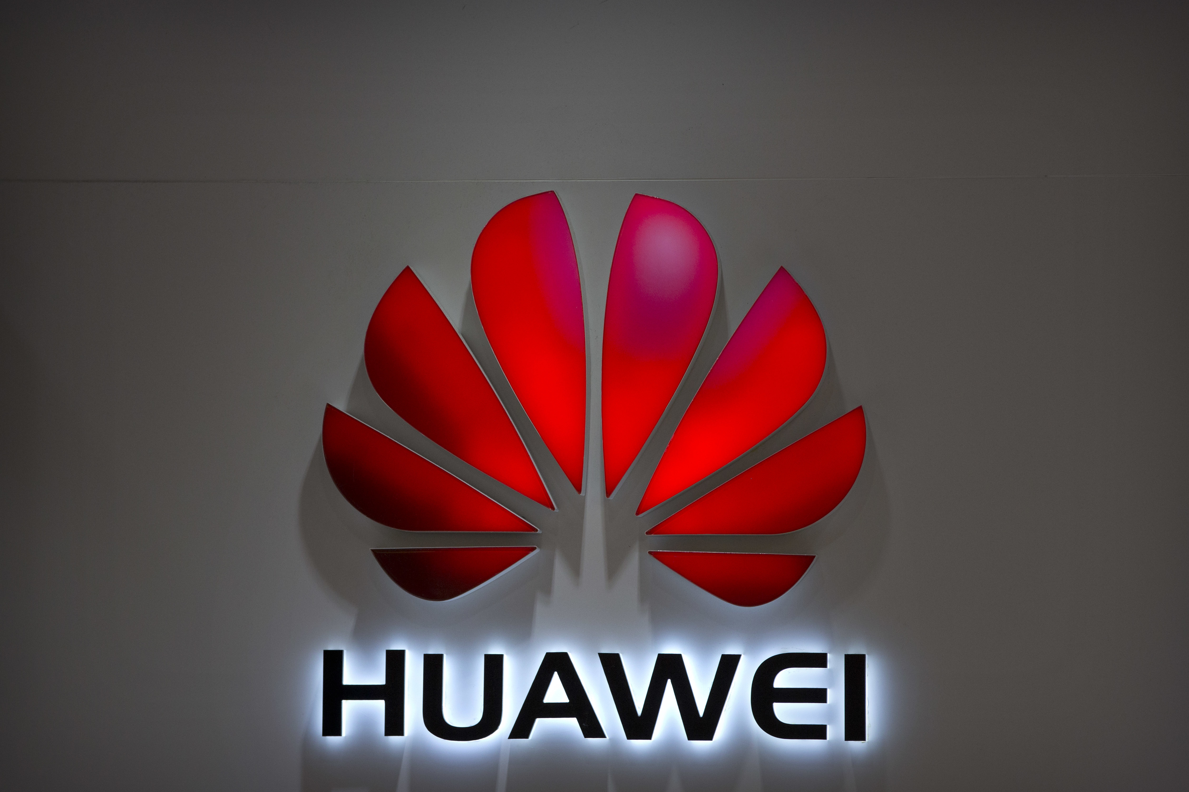 The Latest: Warner calls Huawei threat to national security