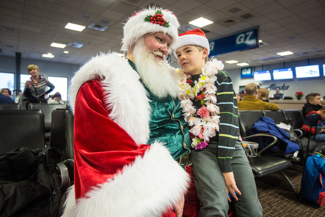 Johnny Alley, 10, talks to Santa during the annual Snowball Express, an event for children and spouses of fallen military heroes, at the Salt Lake City International Airport on Saturday, Dec. 8, 2018. (Photo: Qiling Wang, KSL)