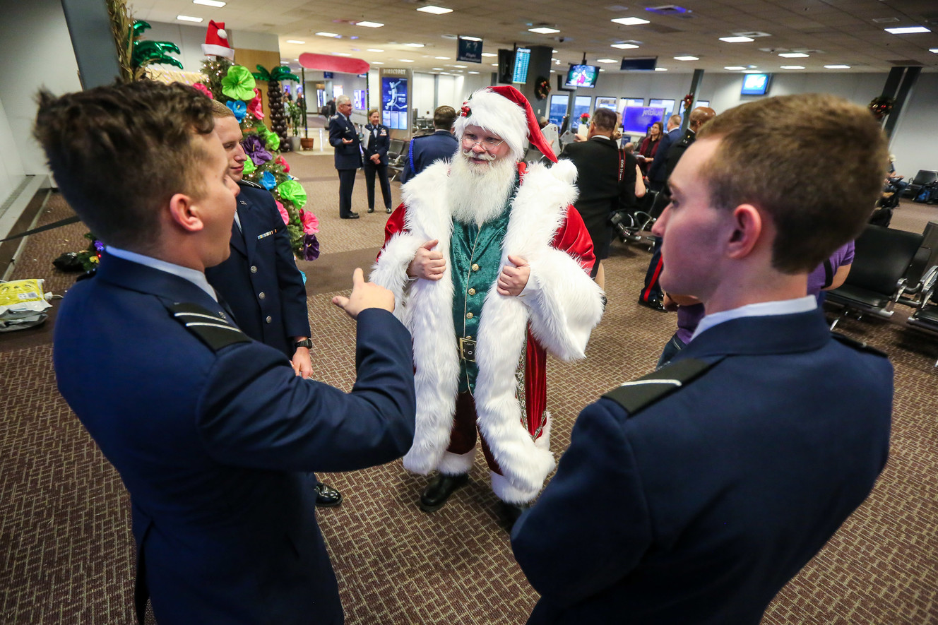Santa talks to service members during the annual Snowball Express, an event for children and spouses of fallen military heroes, at the Salt Lake City International Airport on Saturday, Dec. 8, 2018. (Photo: Qiling Wang, KSL)