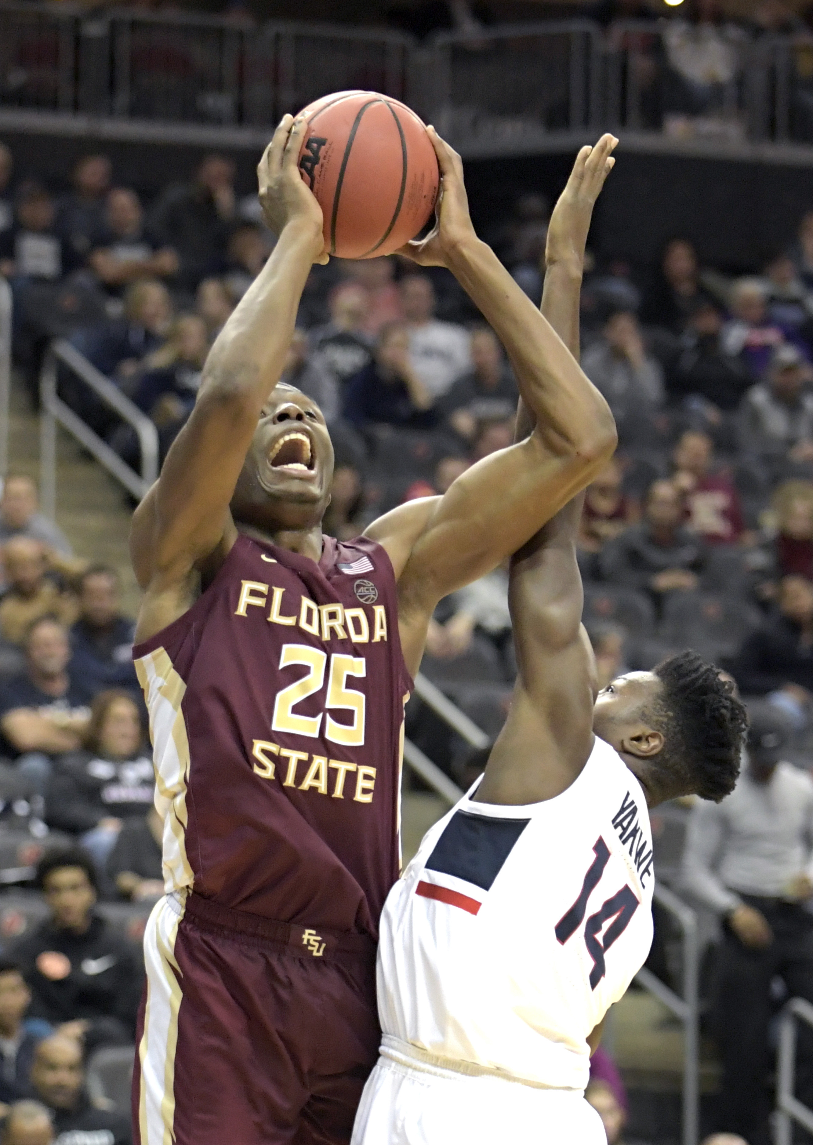 Mann scores 20 as No. 11 Florida State beats UConn 79-71