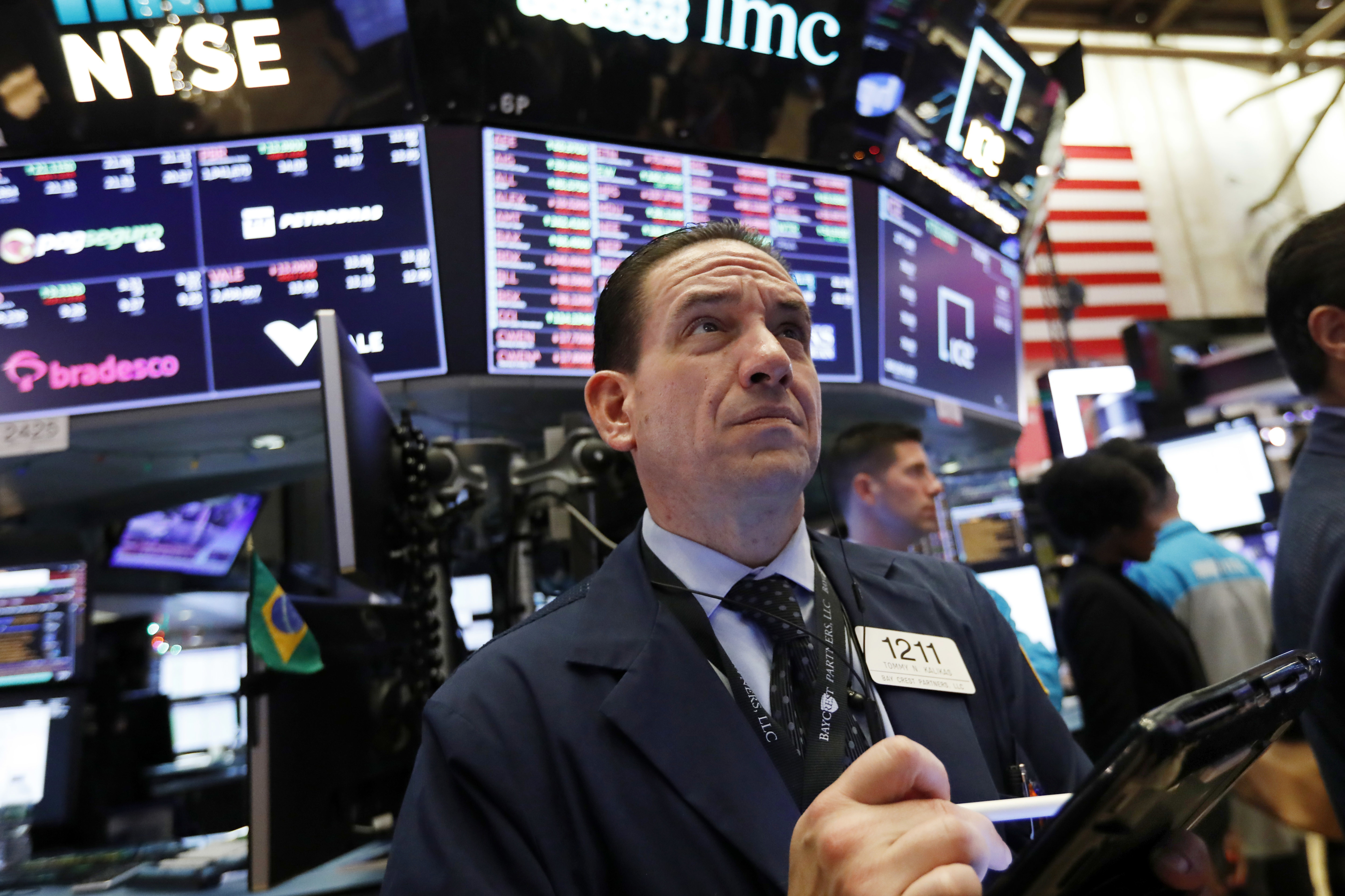 Markets Right Now: Stock market ends mixed after a bumpy day