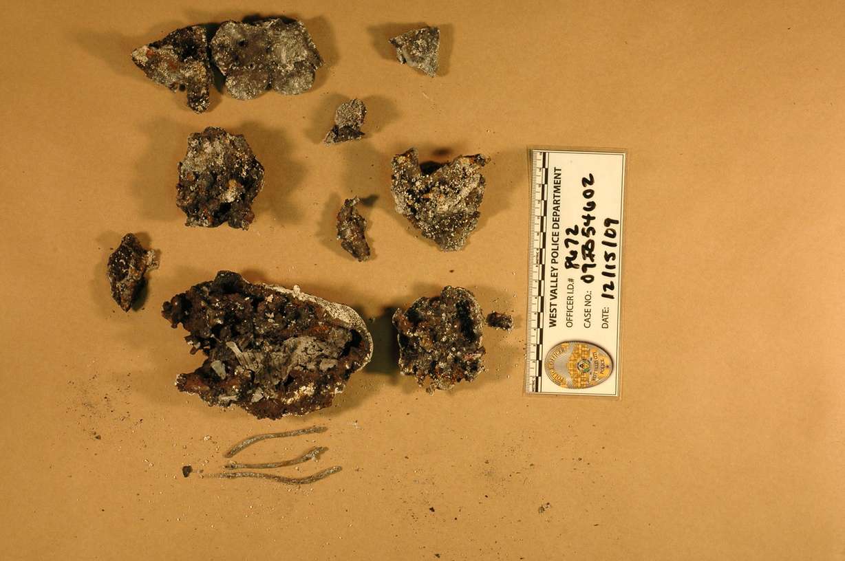 West Valley police detective Ellis Maxwell located this unidentified metal object and wire fragments inside Josh Powell's minivan on the evening on Dec. 8, 2009, a day after Susan Powell's disappearance. The item had been destroyed by heat and has never been identified. (Photo: West Valley City, Utah police)