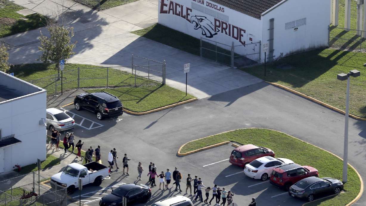 The Latest: Florida panel recommends arming some teachers