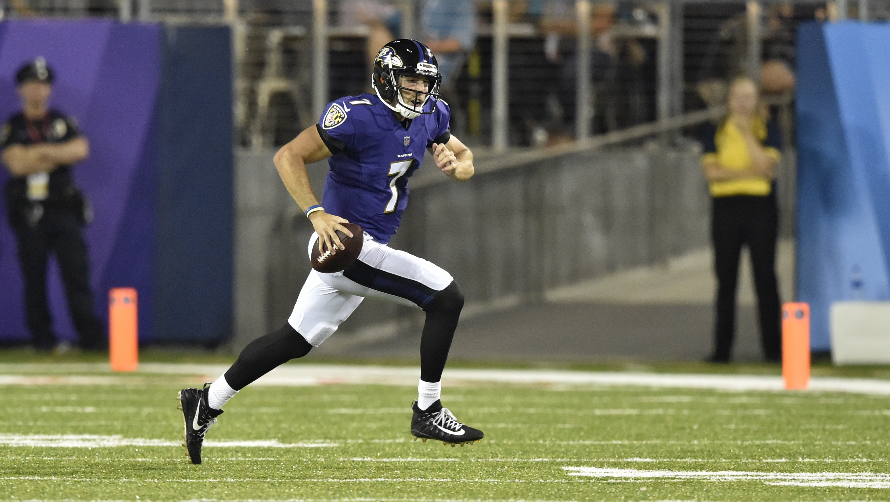 Baltimore Ravens quarterback Josh Woodrum (7) scrambles for a first down in the first half against the Chicago Bears at the Pro Football Hall of Fame NFL preseason game, Thursday, Aug. 2, 2018, in Canton, Ohio. (Photo: David Richard, AP)
