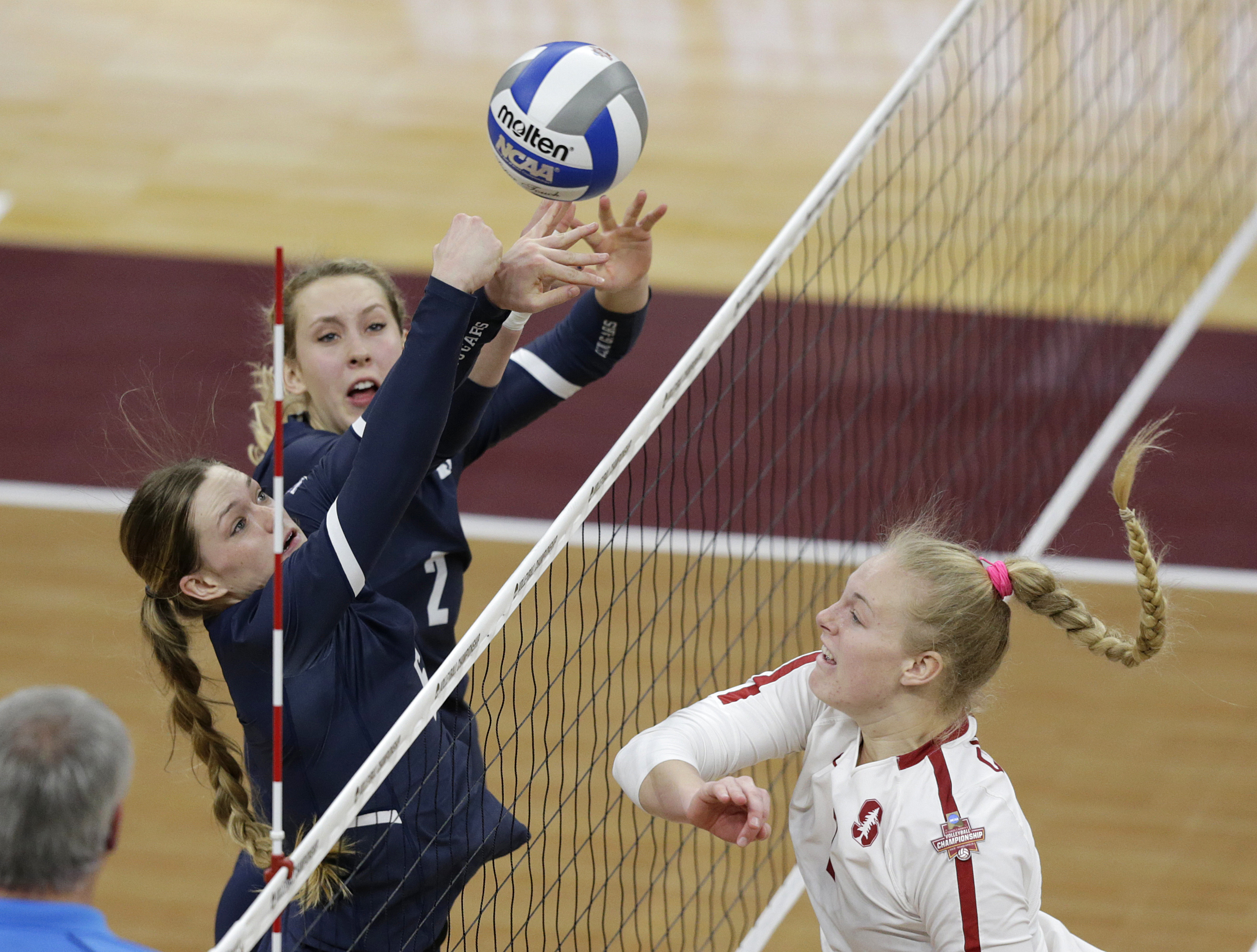 Stanford's Kathryn Plummer, right, hits on the block of BYU's Heather Gneiting (2) and Lyndie Haddock-Eppich (6) in the first set of a semifinal match of the NCAA Div I Women's Volleyball Championships Thursday, Dec. 13, 2018, in Minneapolis. (Photo: Andy Clayton-King, AP)