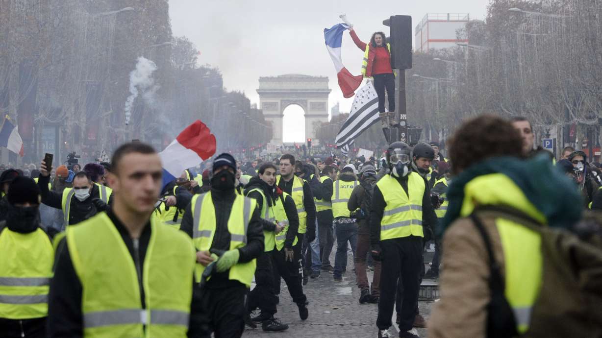 The Latest: Macron calls for calm and order before protests