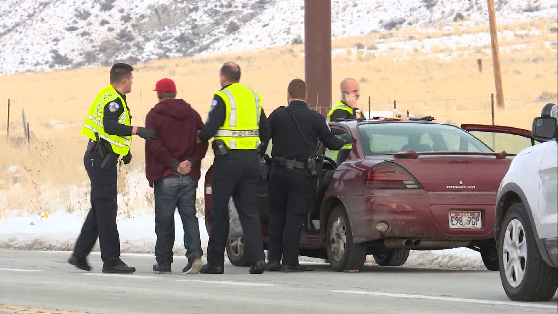 Police take a person into custody after a police chase ended in Tooele on Friday, Dec. 14, 2018. (Photo: Derek Petersen, KSL TV)