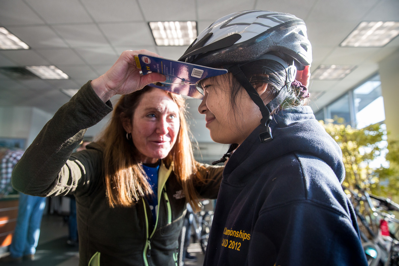 San San Win, 14, is given a helmet by Free Bikes 4 Kidz at Nate Wade Subaru in Salt Lake City on Saturday, Dec. 15, 2018. (Photo: Qiling Wang, KSL)
